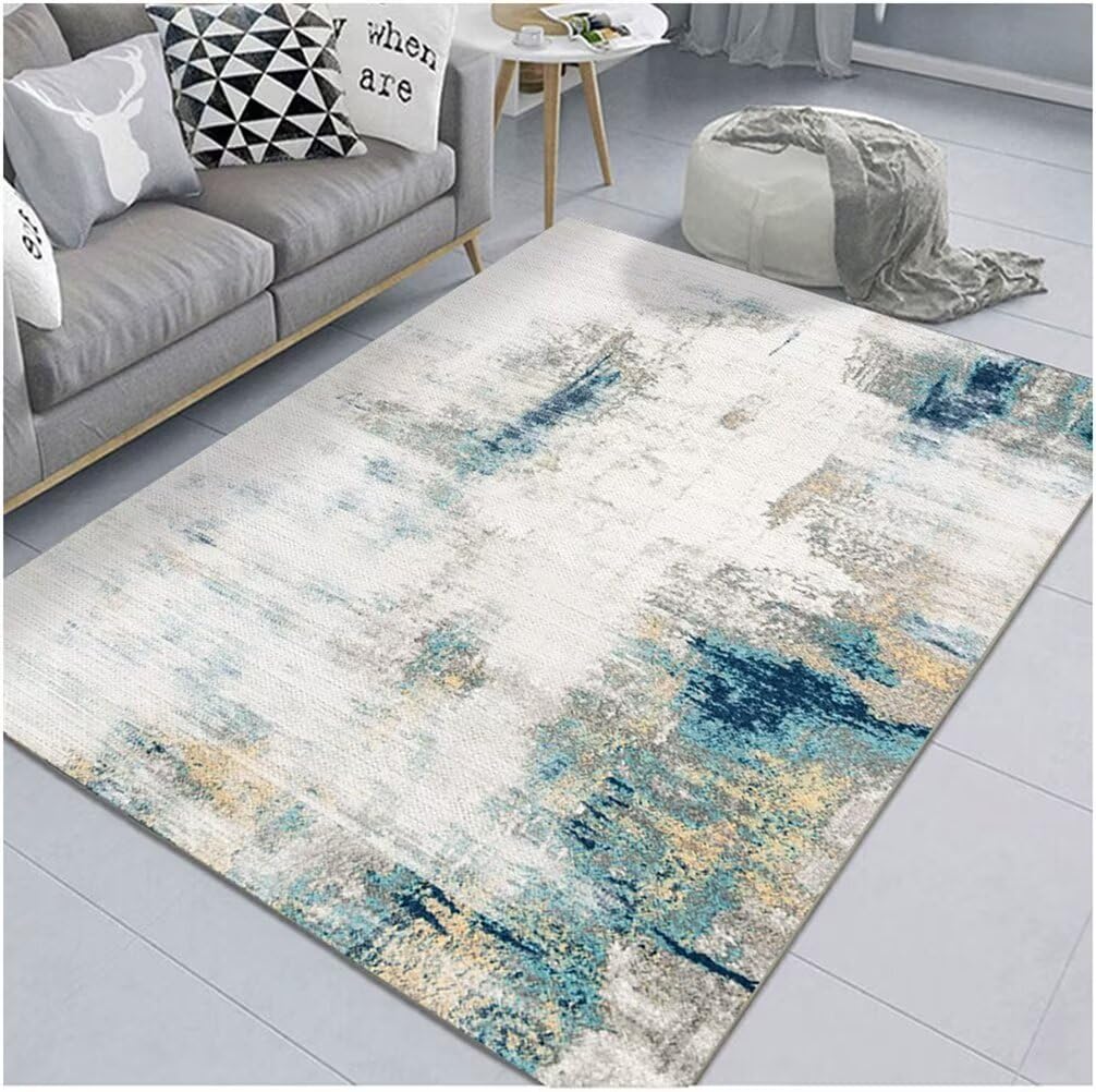 Tapis salon poil court bleu 180x230 cm avec un motif d'encre abstrait
