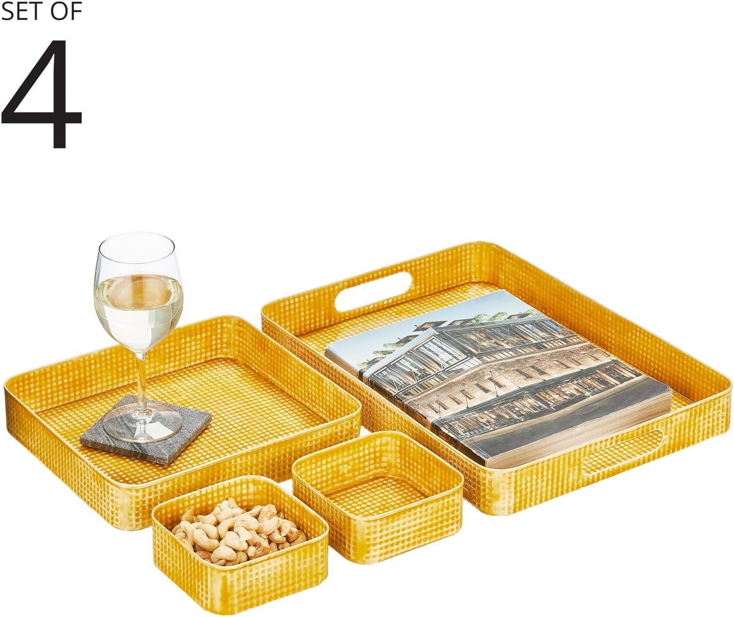 The mDesign tray set arranged with a wine glass, a book, and cashews, demonstrating potential uses.