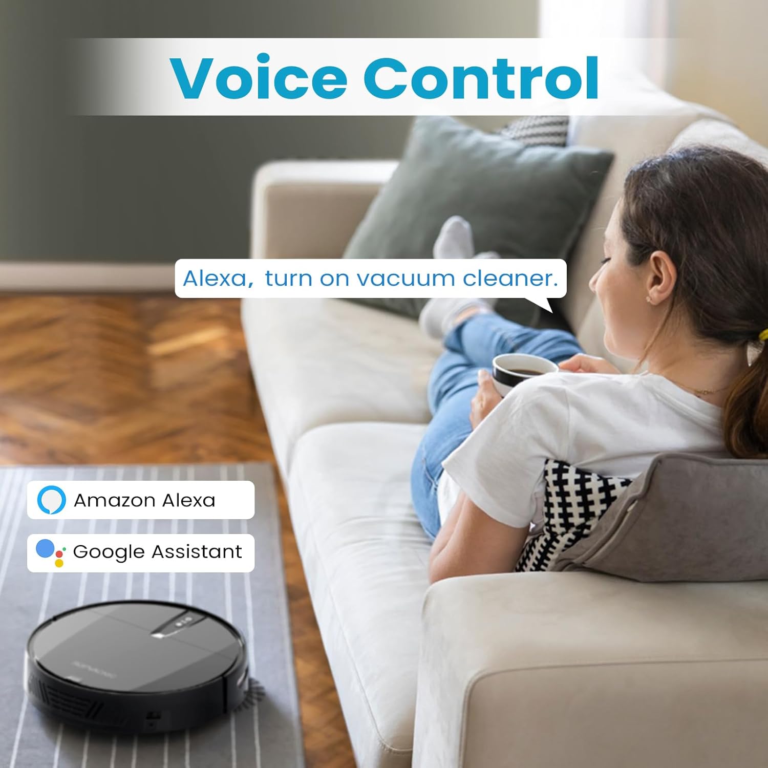 A woman relaxing on a couch, speaking a voice command to an Amazon Alexa device to start the robot vacuum.