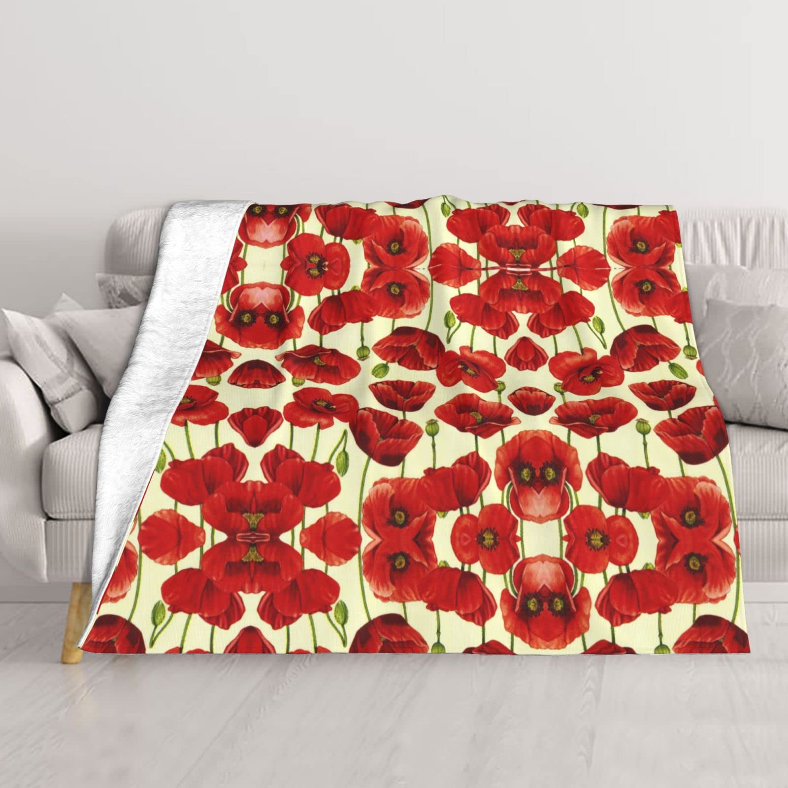 Couverture thermique douce pour des moments cocooning sur le canapé ou en camping