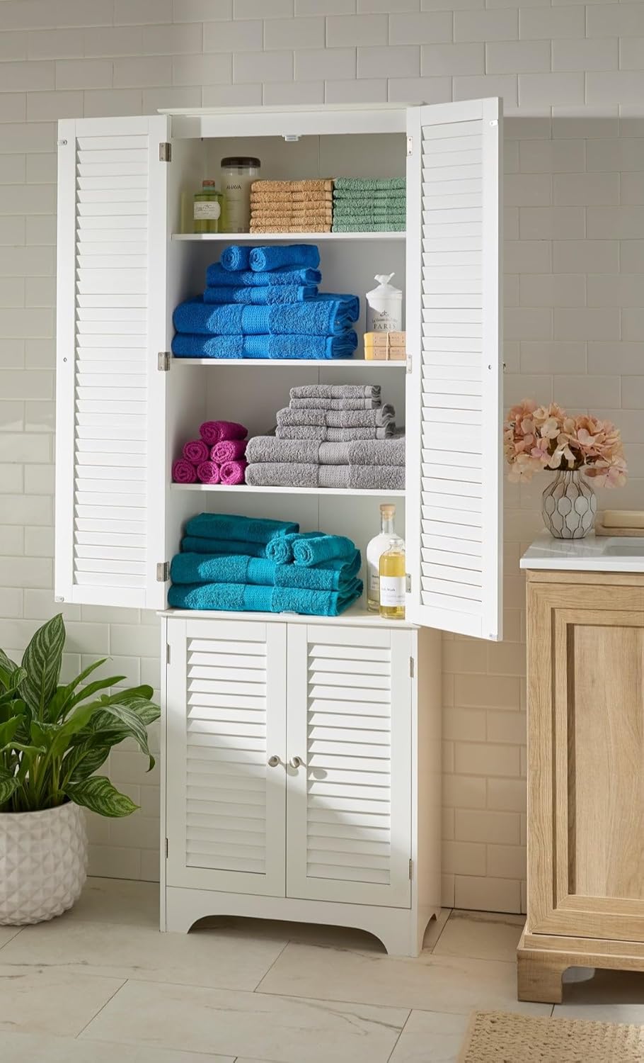 BrylaneHome Louvre Linen Cabinet with doors open, showing organized towels and toiletries on shelves.