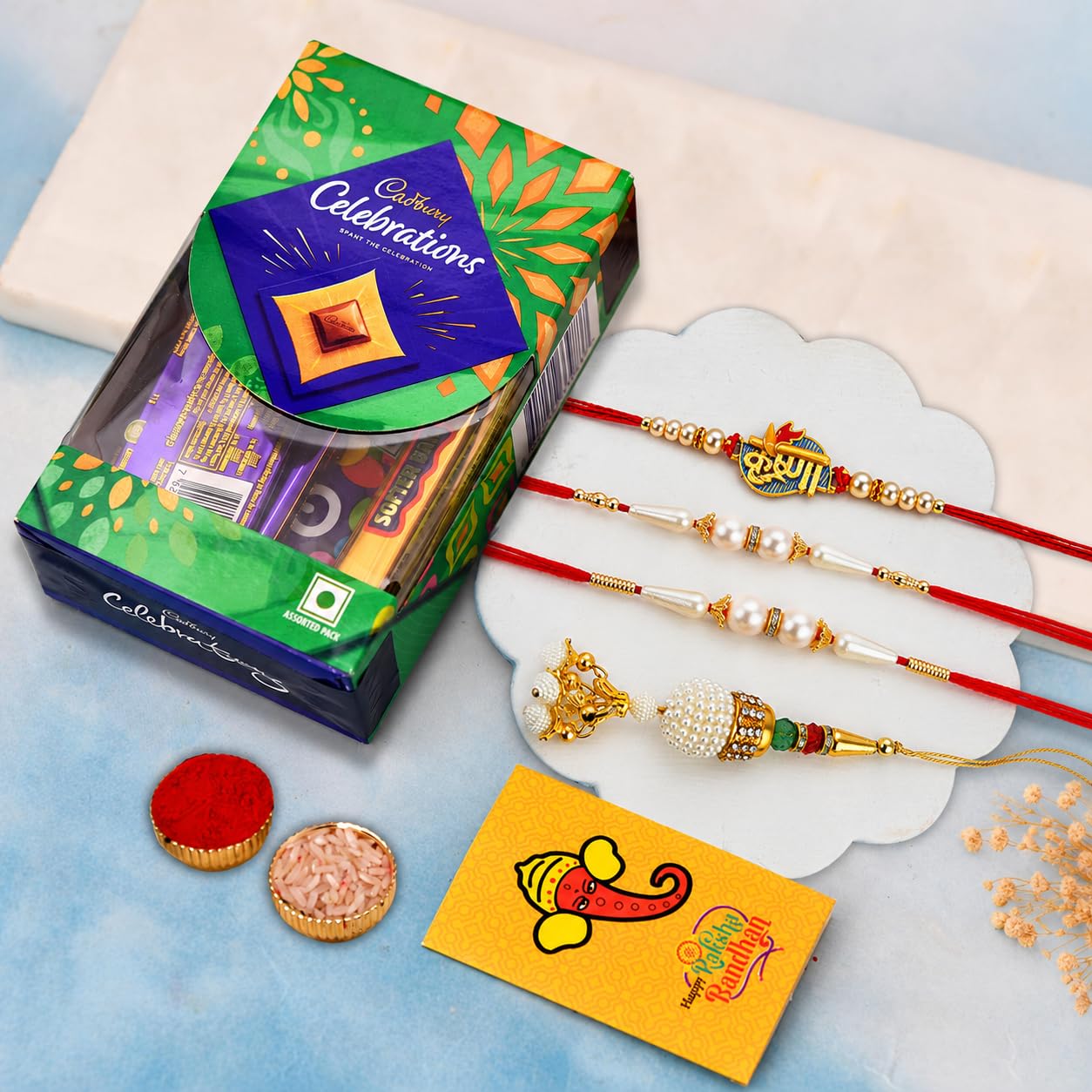 Rakhi Chocolate Gift Combo Set of 4 for Brother and Bhabhi Kids with Chocolate Gift Combo, Rakhi with Cadbury, Krishna Lumba Pearl Rakhi for Small Family on Rakshabandhan-image-29