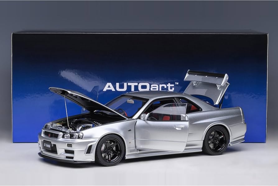 NISSAN　GT-R (R34) NISSAN SKYLINE GT-R R34 V-SPEC RHD ACTIVE RED 1/64 DIECAST