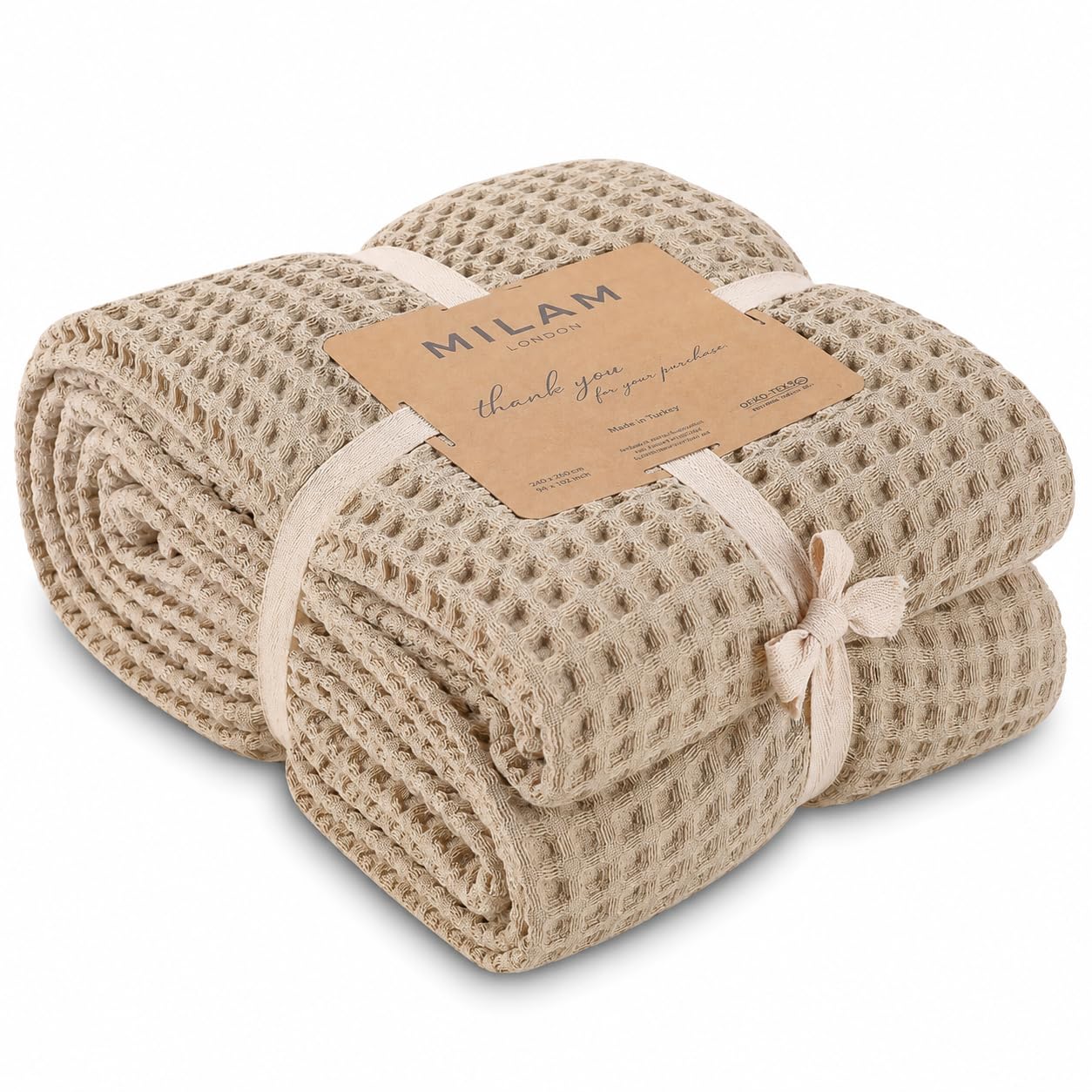 Couvre-lit en coton doux beige pour grand canapé de salon chaleureux