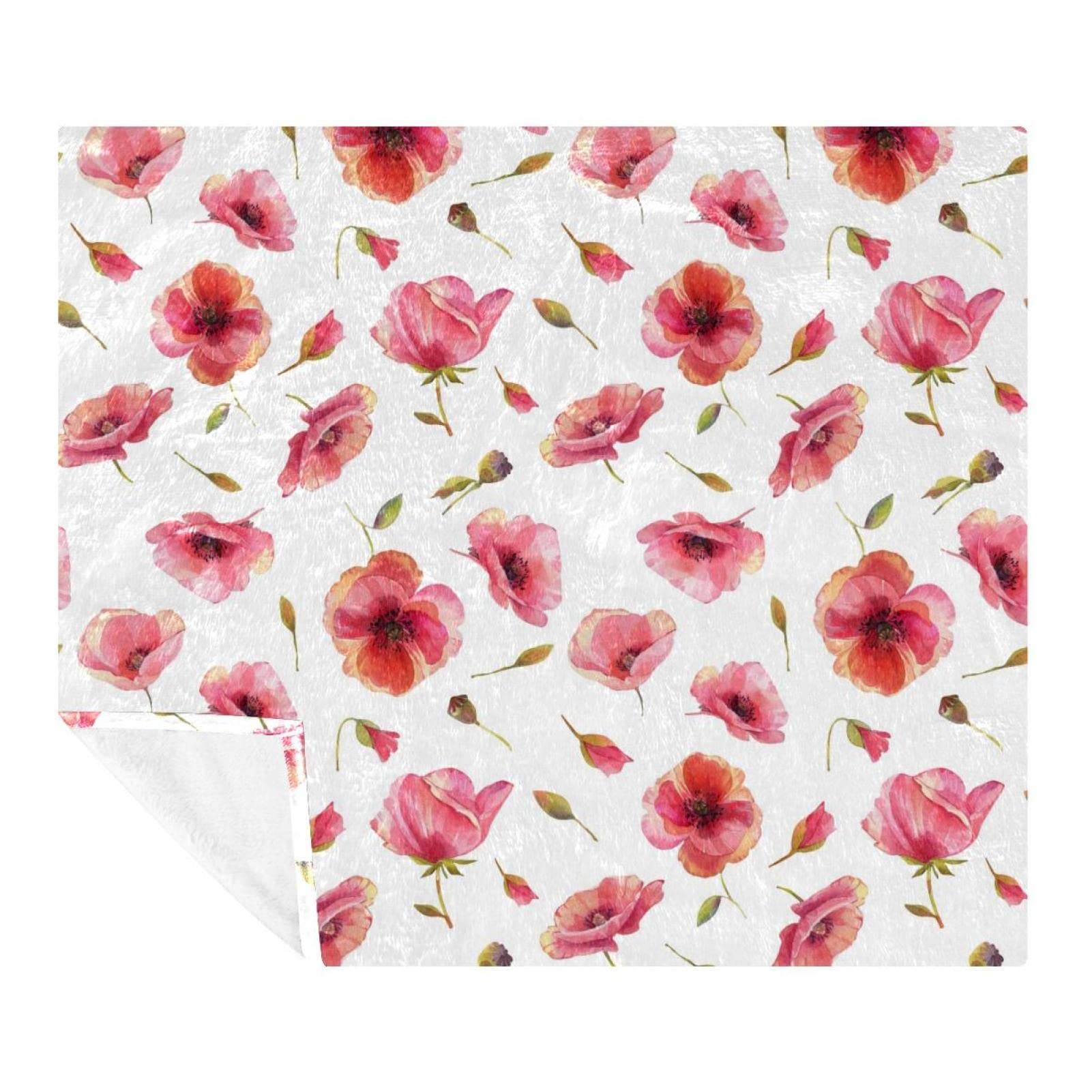 Couverture polaire coquelicots douce pour vos soirées cocooning sur le canapé