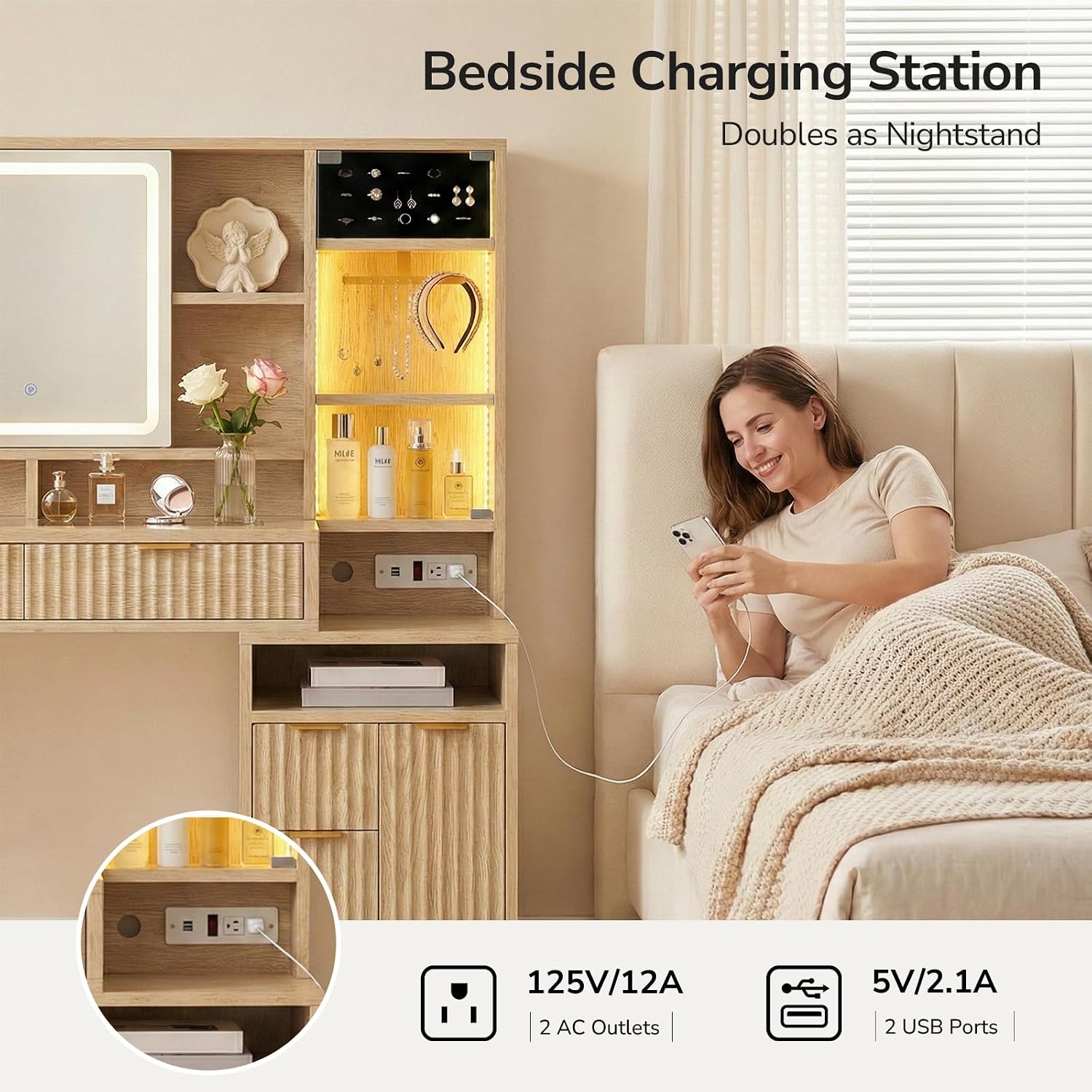 Image showing the bedside charging station with two AC outlets and two USB ports, with a person using a phone while sitting next to the vanity.