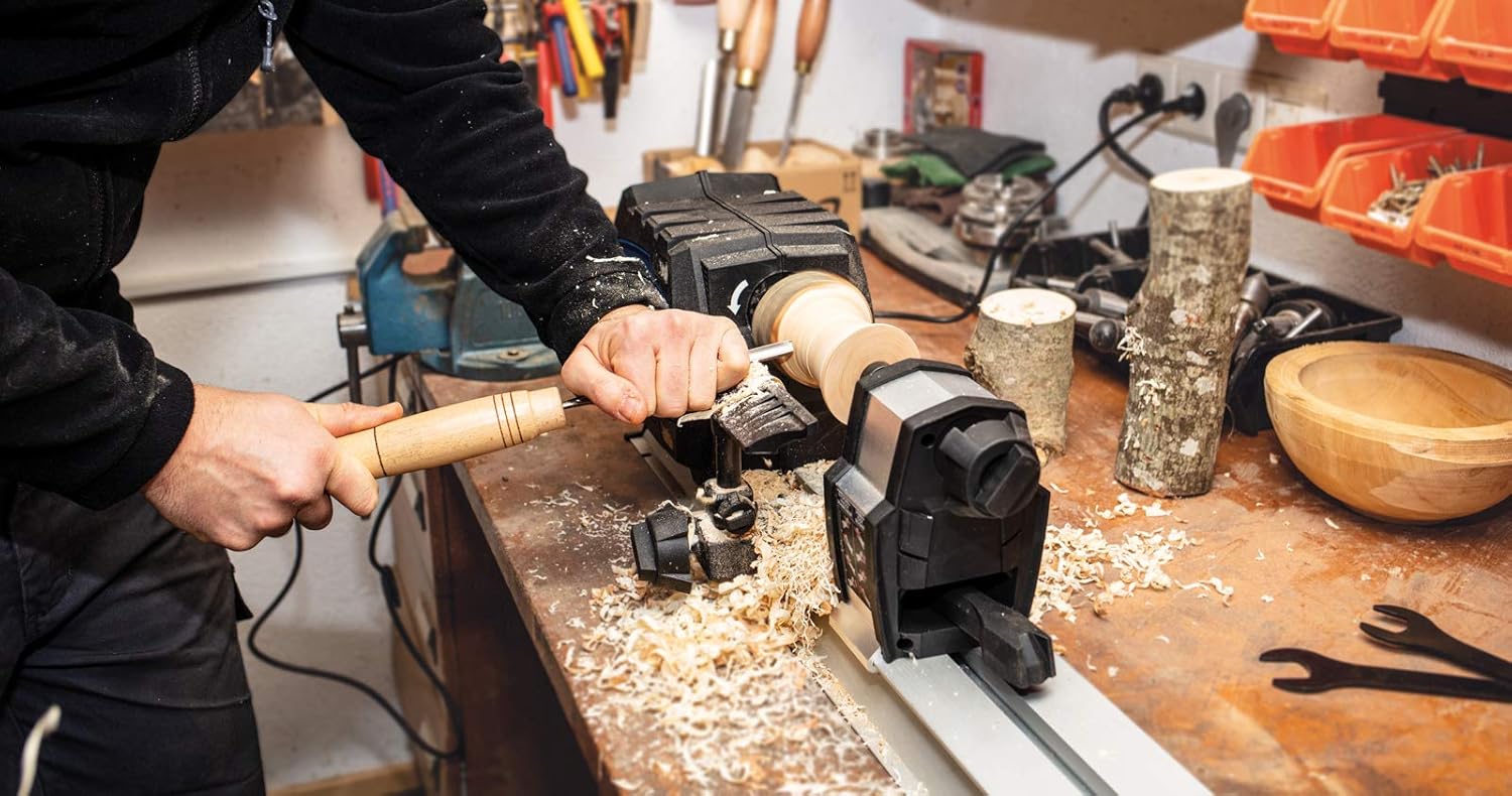 Operator turning wood on the lathe, top view