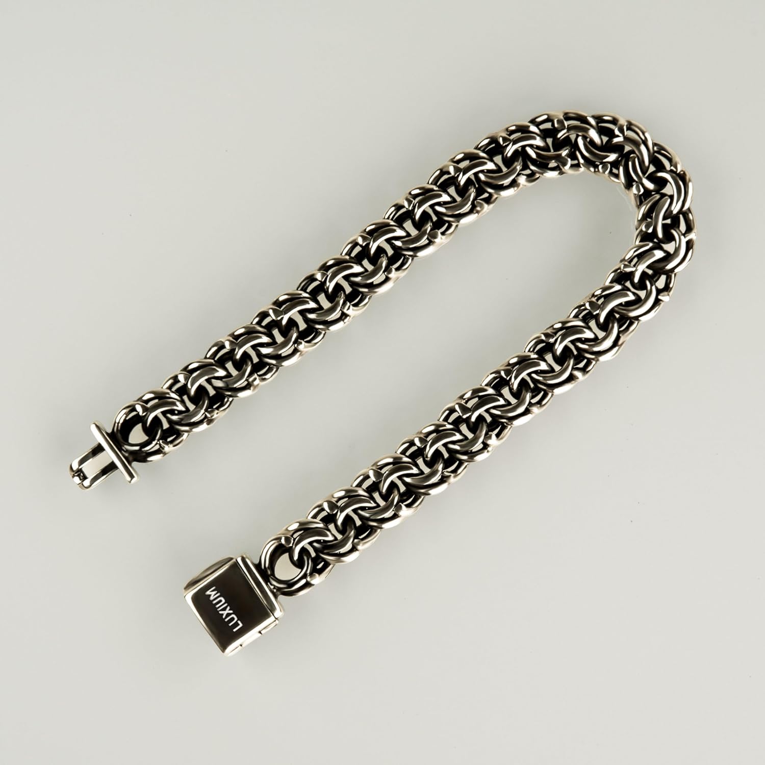 LUXIUM Bismark Bracelet: Sterling silver woven into an intricate double loop, uniting polished brilliance with oxidized depth—refined, dimensional, and boldly elegant.