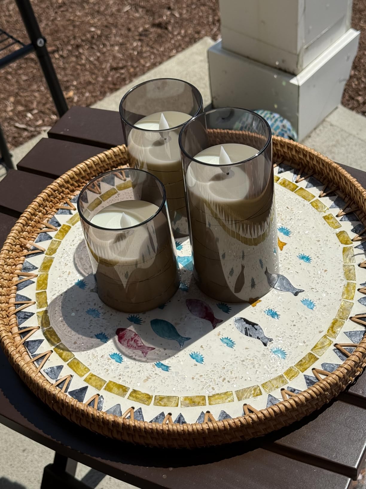 A round mother-of-pearl tray with a rattan base, perfect for holding fruit, coffee table trays, storage, and display organizers. photo review