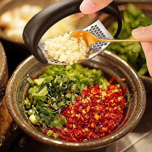 Miniatura 7 de Prensa de ajo de acero inoxidable, nuevo balancín de prensa de ajo, utensilios de cocina para el hogar, trituradora de ajo manual portátil para