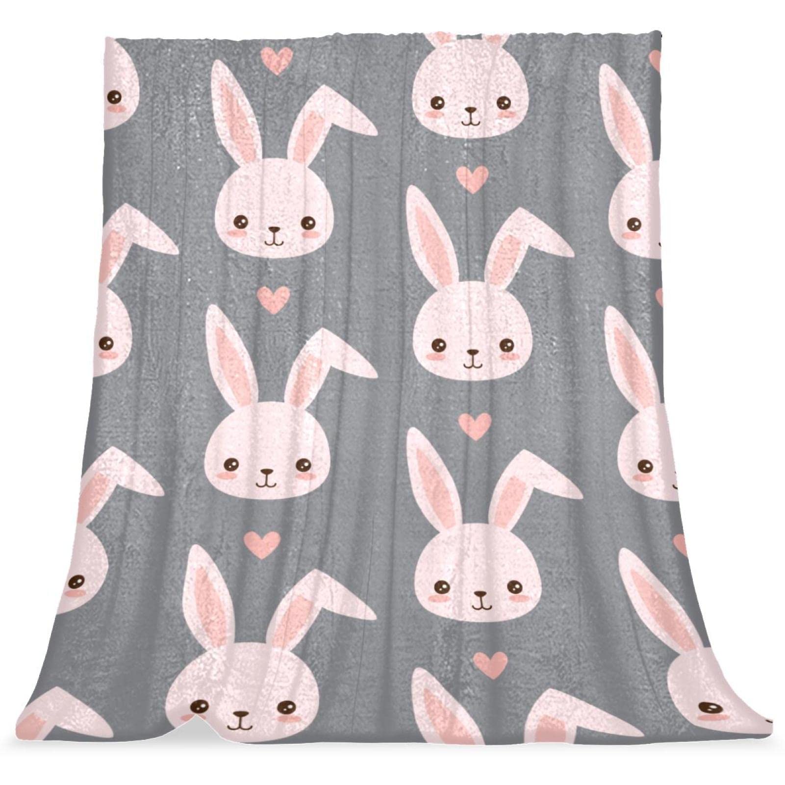 Couverture de lit moelleuse lapin rose pour des siestes douces en chambre d'enfant