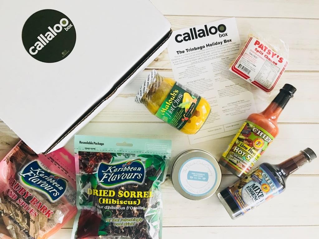 The Trinidad & Tobago Holiday Box by Callaloo Box: Hot Chow, Mauby Bark, Dried Sorrel, Lime Pepper Sauce, Mixed Essence, Black Cake, Split Channa - Caribbean Food Box