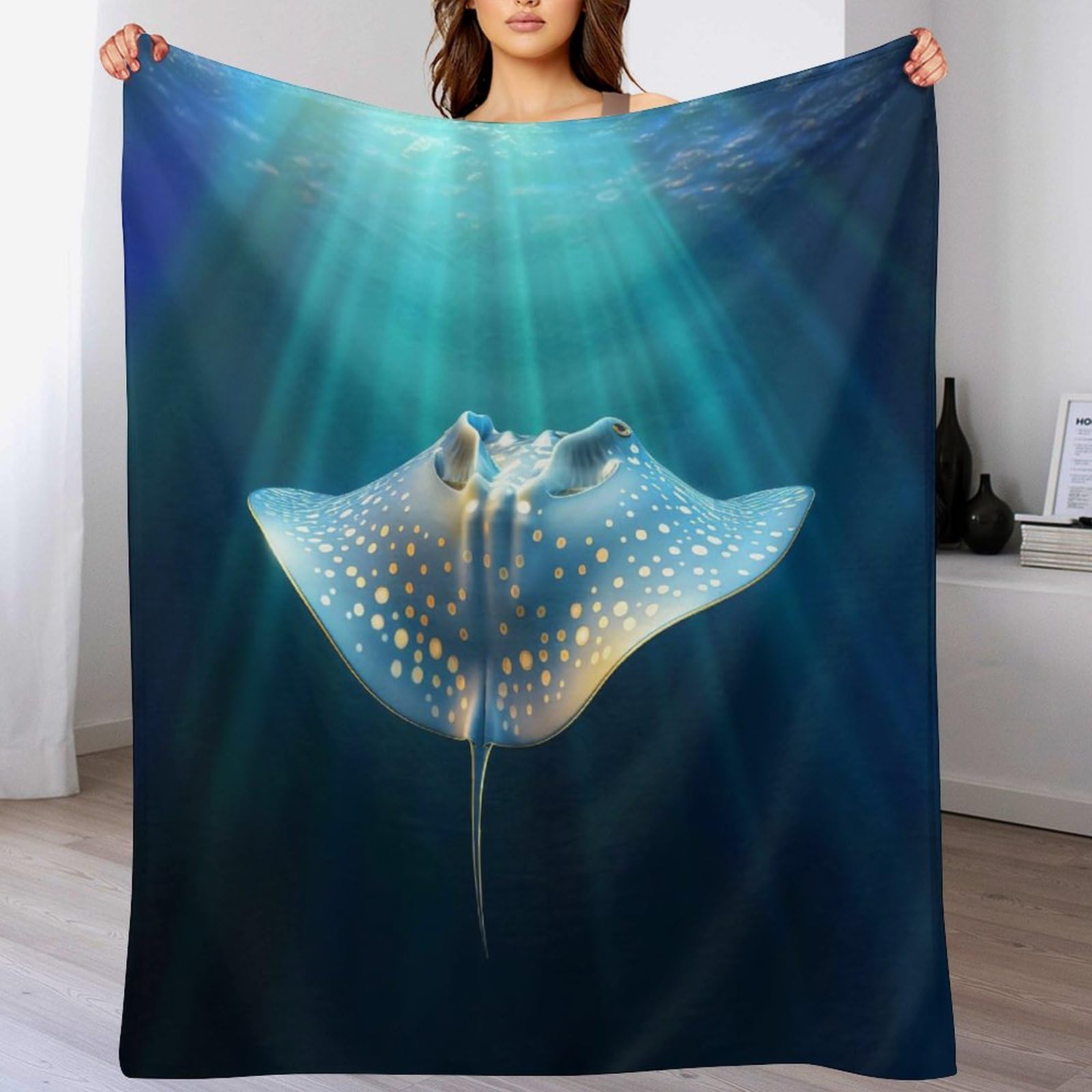 Couverture polaire MFourmia Ray pour des soirées cocooning réussies sur le canapé-lit du salon