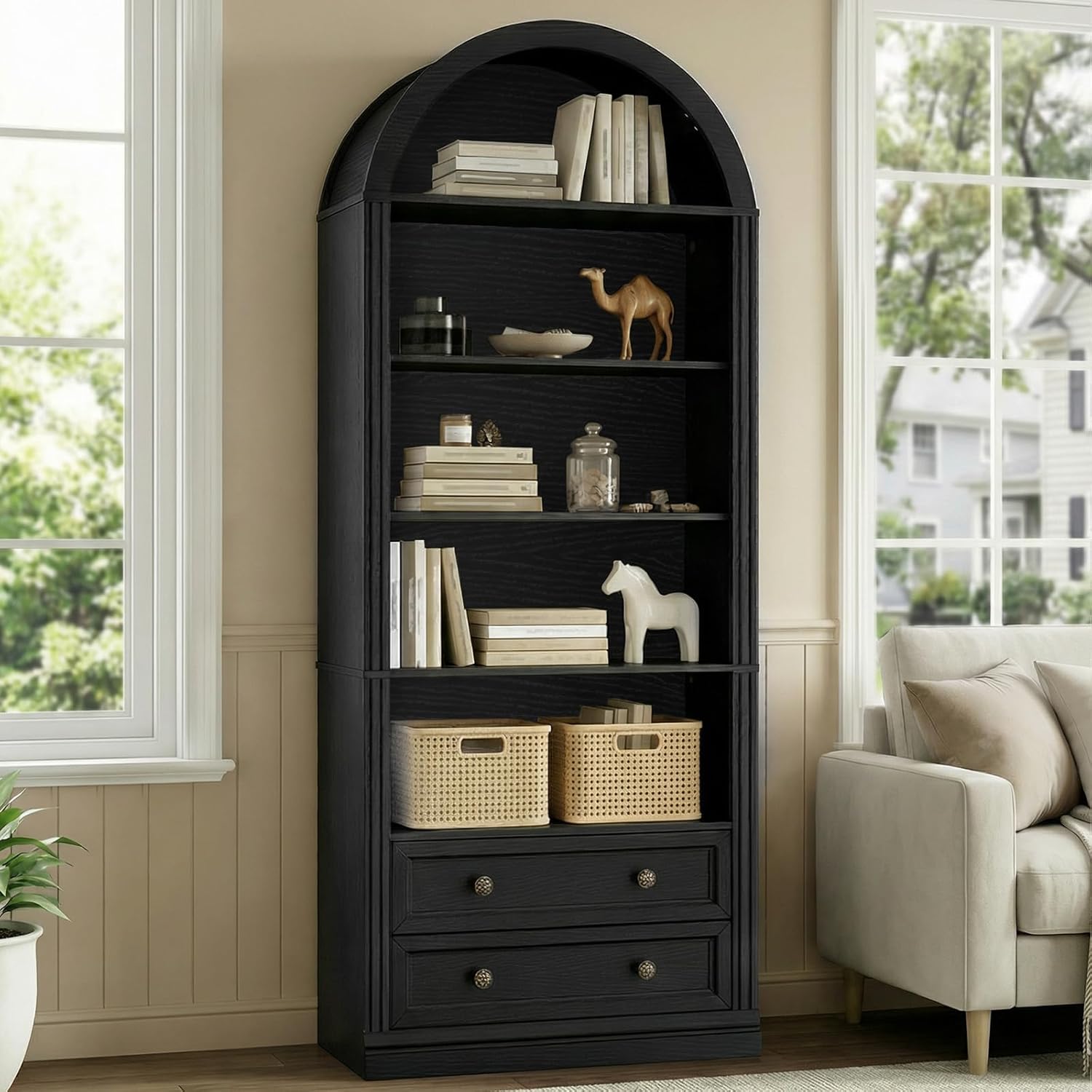 RALGEND Farmhouse Arched Bookshelf in a living room, adorned with decorative baskets and books.