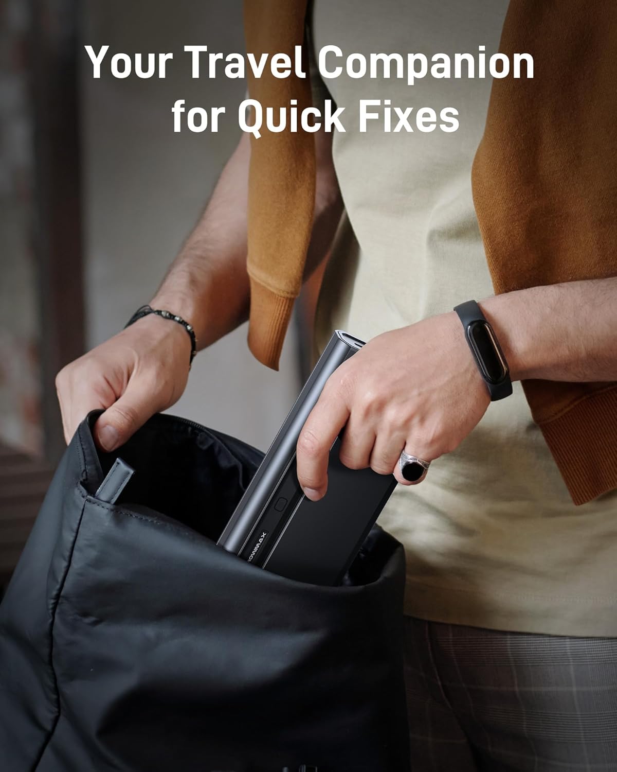 Person placing the screwdriver case into a backpack