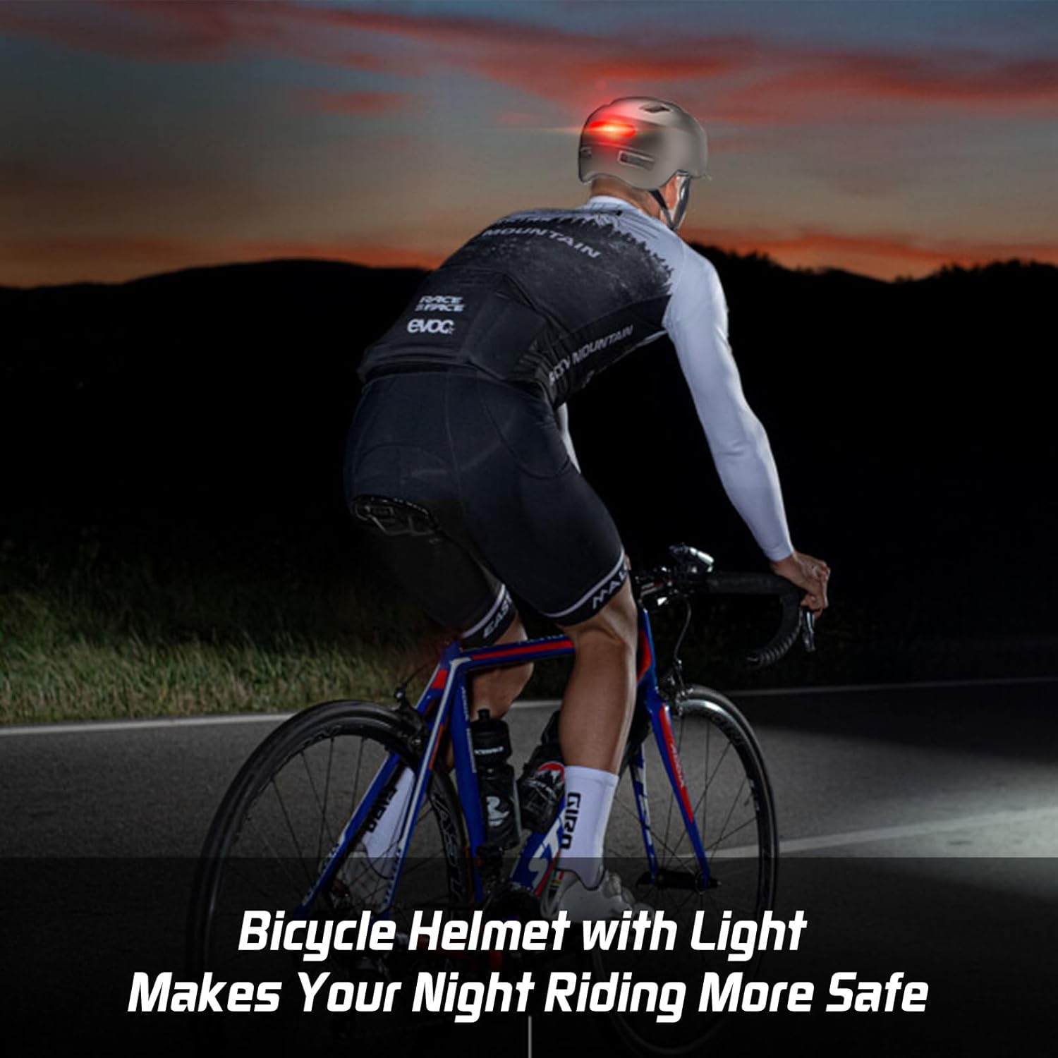 Cyclist wearing Shinmax Bike Helmet with illuminated rear LED light during night riding.