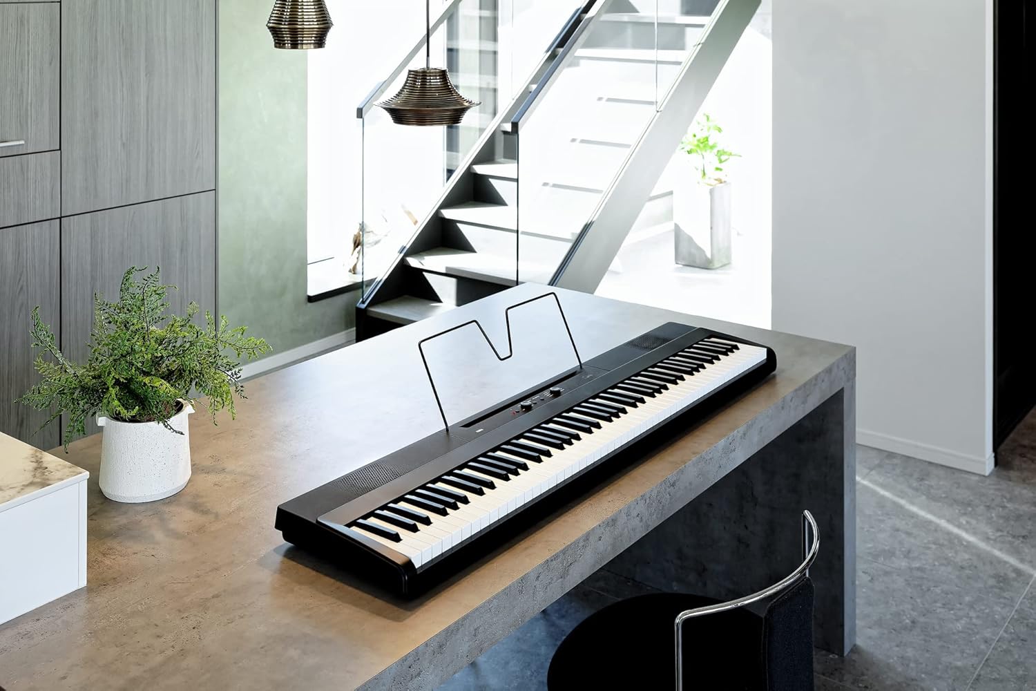 Korg Liano Digital Piano on a stand with the sustain pedal on the floor.