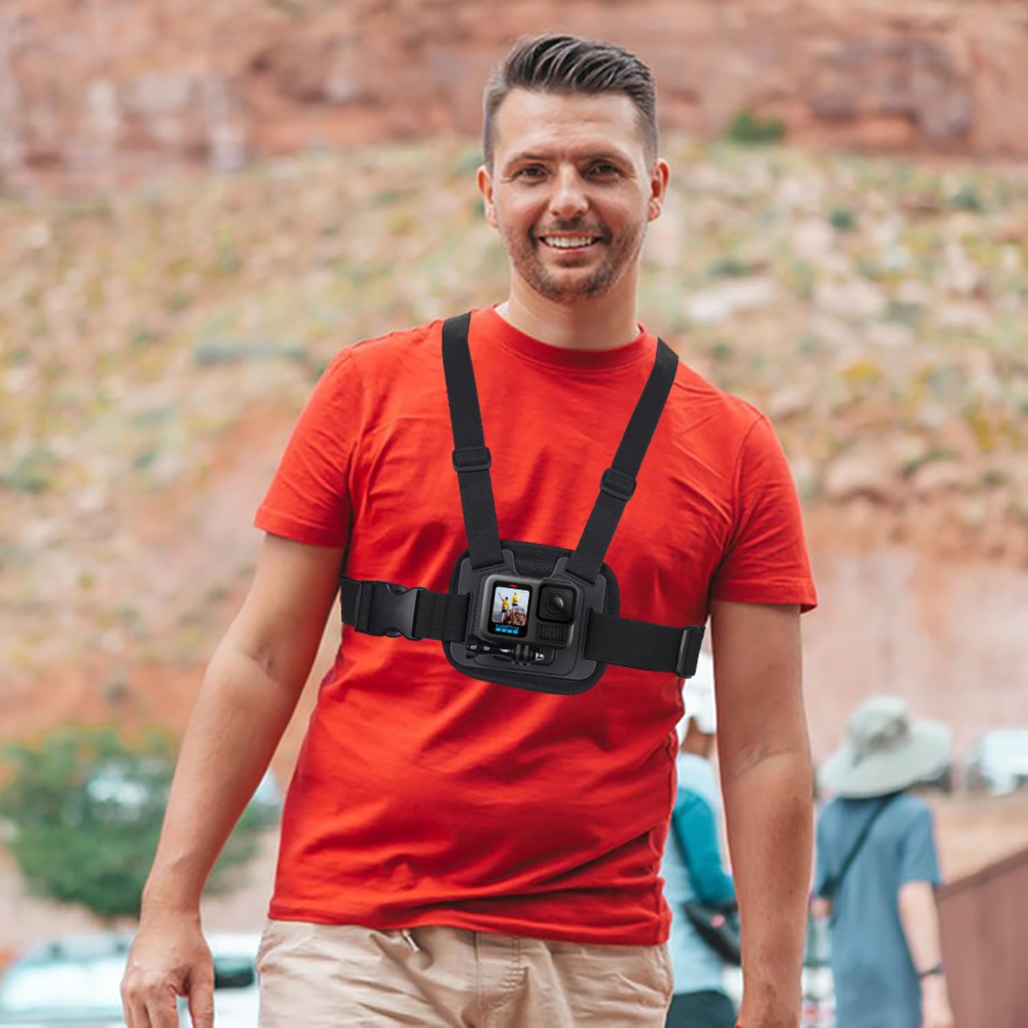 Man wearing Suptig Dual Chest Mount with a GoPro camera attached, walking outdoors.