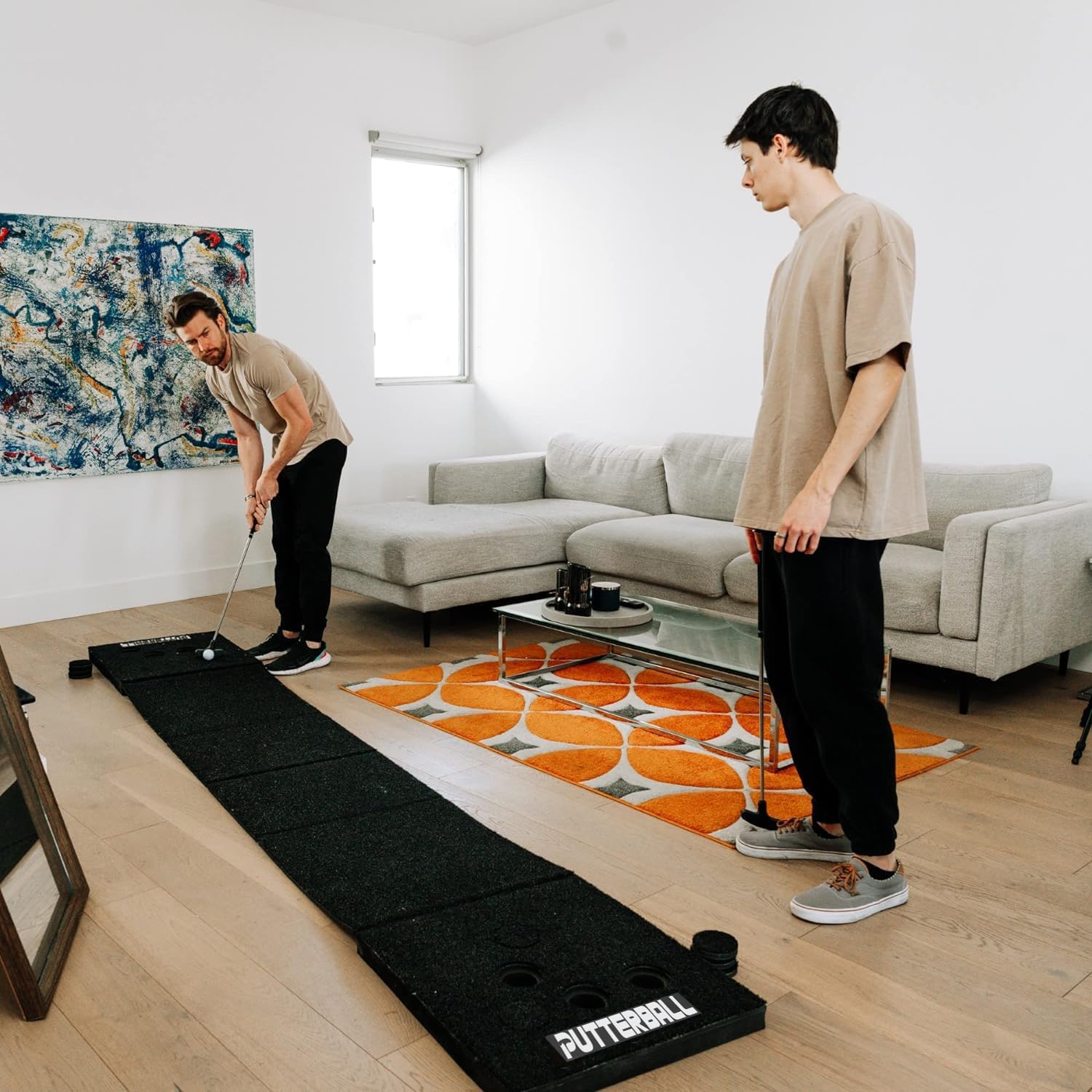 PutterBall Golf Game Set The Original - Includes 2 Putters, 2 Golf Balls, Black Putting Mat, Hole Covers - Best Backyard Party Game Set