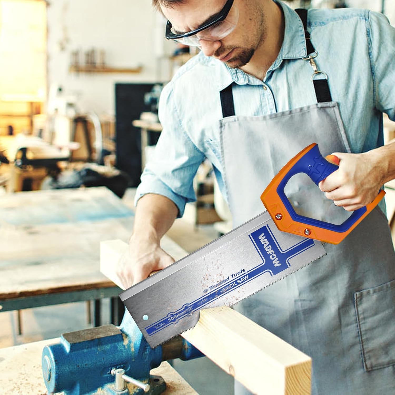Person using WADFOW hand saw to cut wood