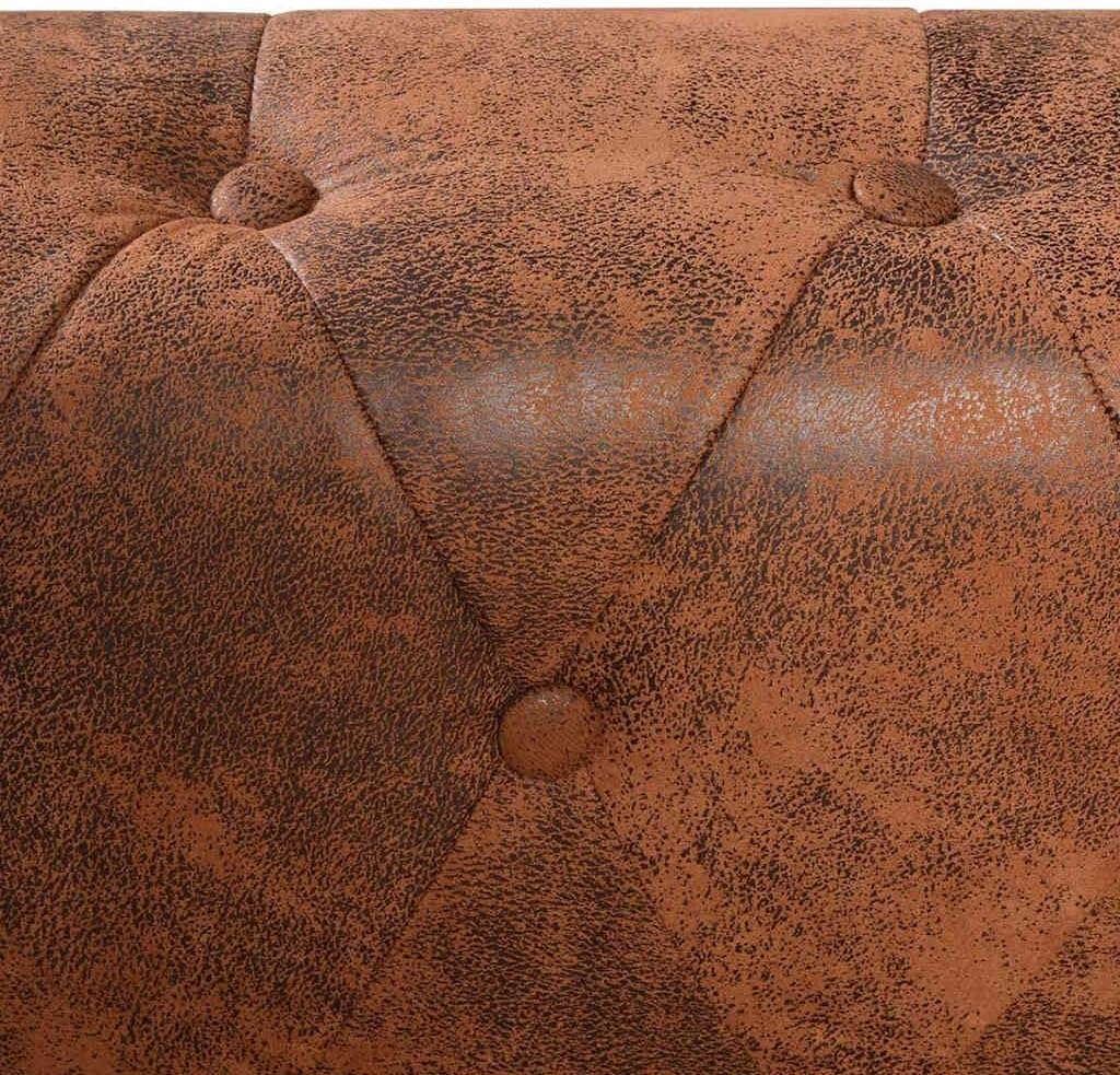 Close-up of the armrest with decorative nailhead trim on the sofa