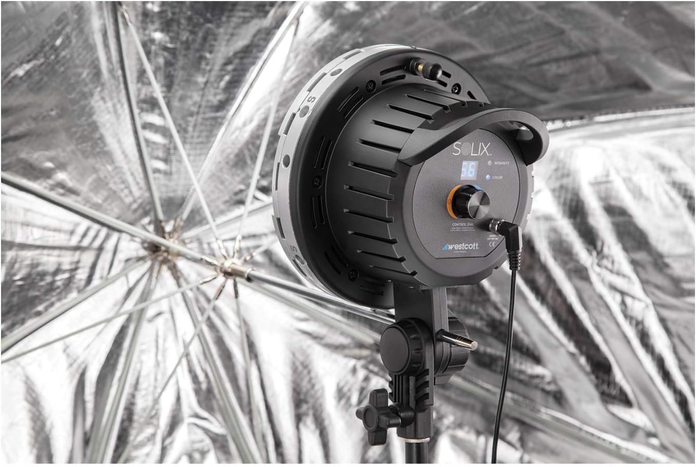 Westcott Solix LED light in use with an umbrella