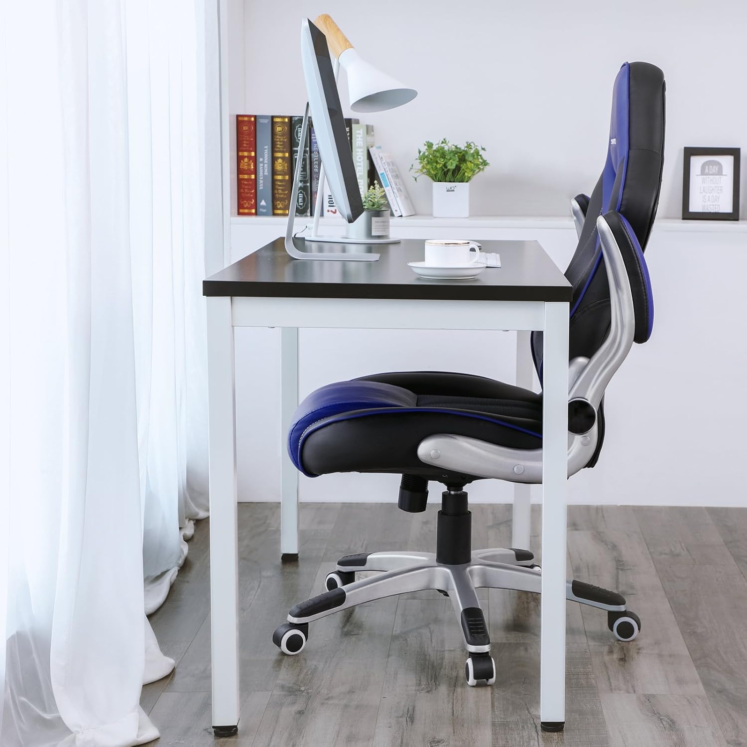 SONGMICS Ergonomic Gaming Office Chair positioned next to a desk in an office setting.