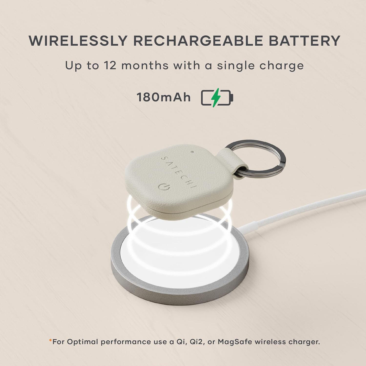 Satechi FindAll Keychain wirelessly charging on a pad