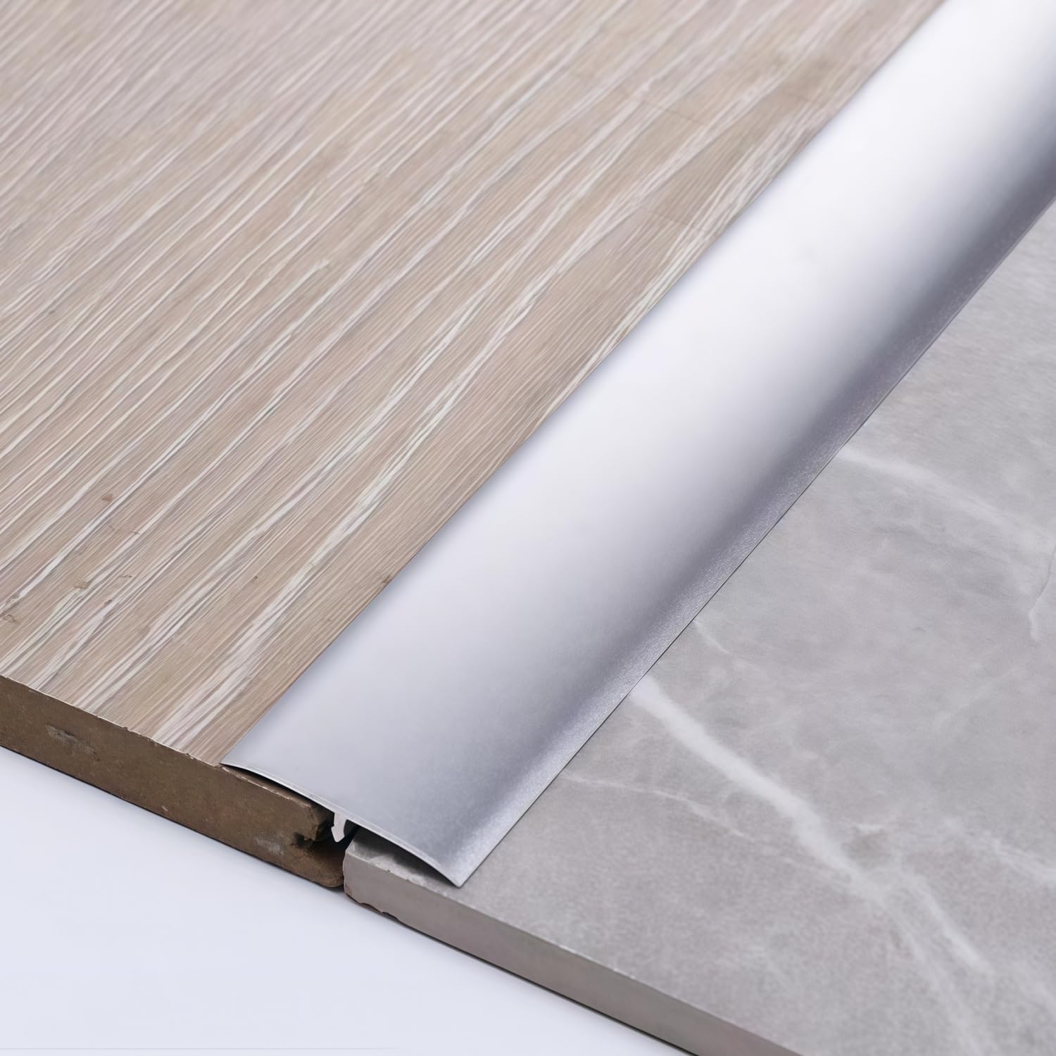 Moldura en T de aluminio para tapar juntas de suelos dilatados