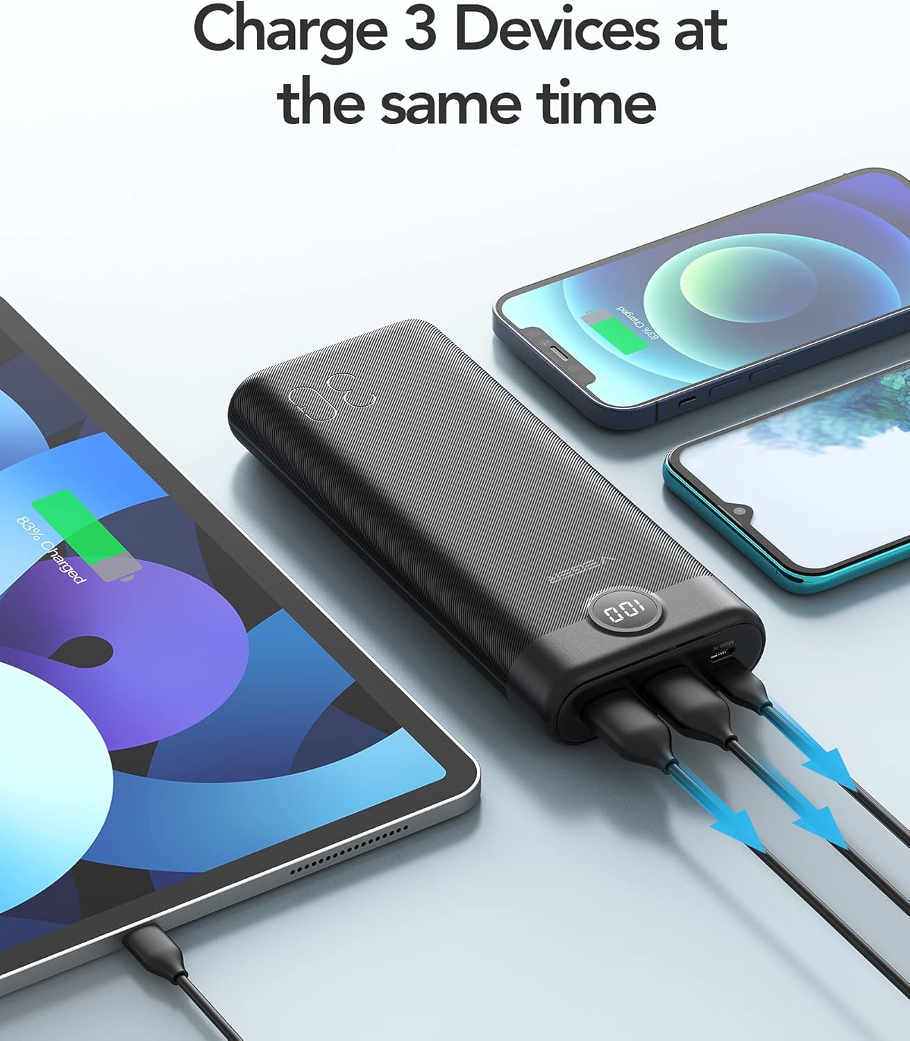 VEGER power bank charging an iPhone, Samsung phone, and iPad simultaneously.