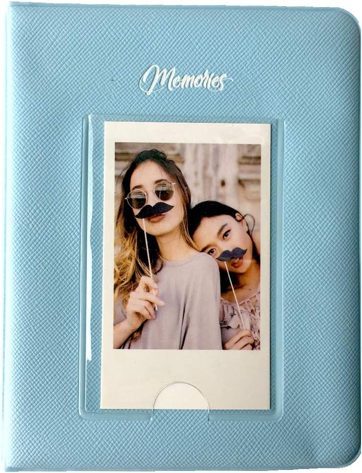Blue mini photo album with 'Memories' written on the cover, displaying an instant photo of two people