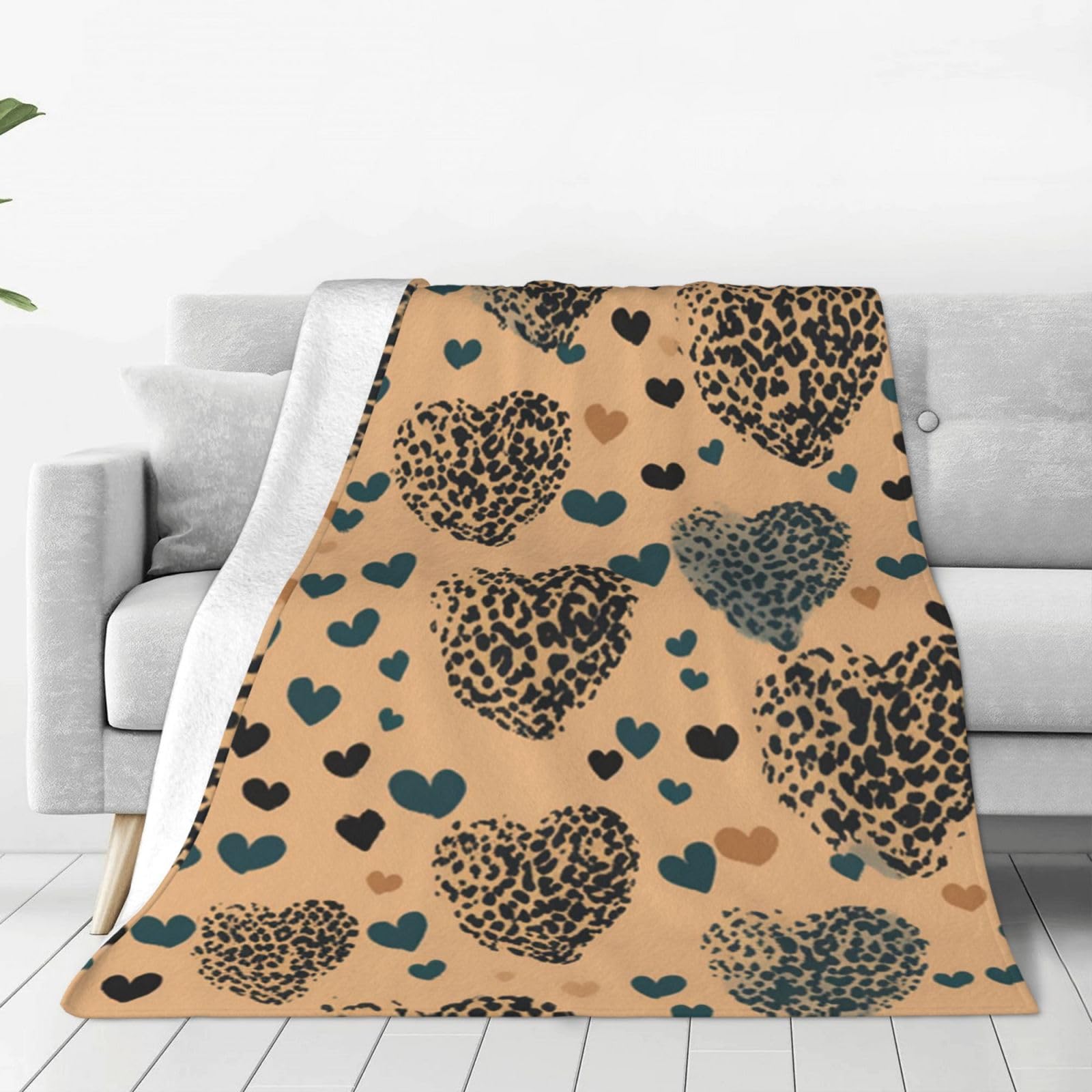 Couverture flanelle canapé imprimé léopard pour cocooning en famille