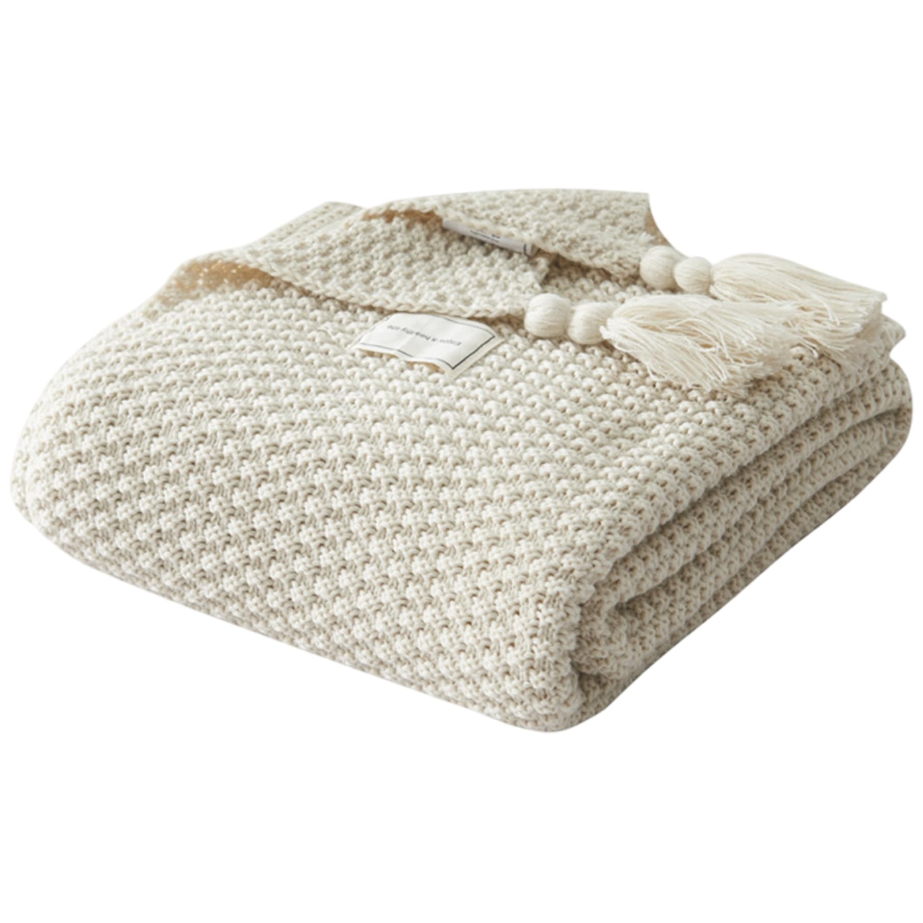 Couverture tricotée chaude avec pompons doux pour un confort thermique sur le canapé