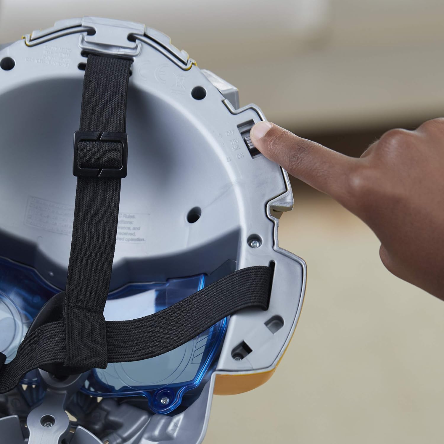 Enterijer view of the Bumblebee Voice Changer Mask, showing the battery compartment and power switch.