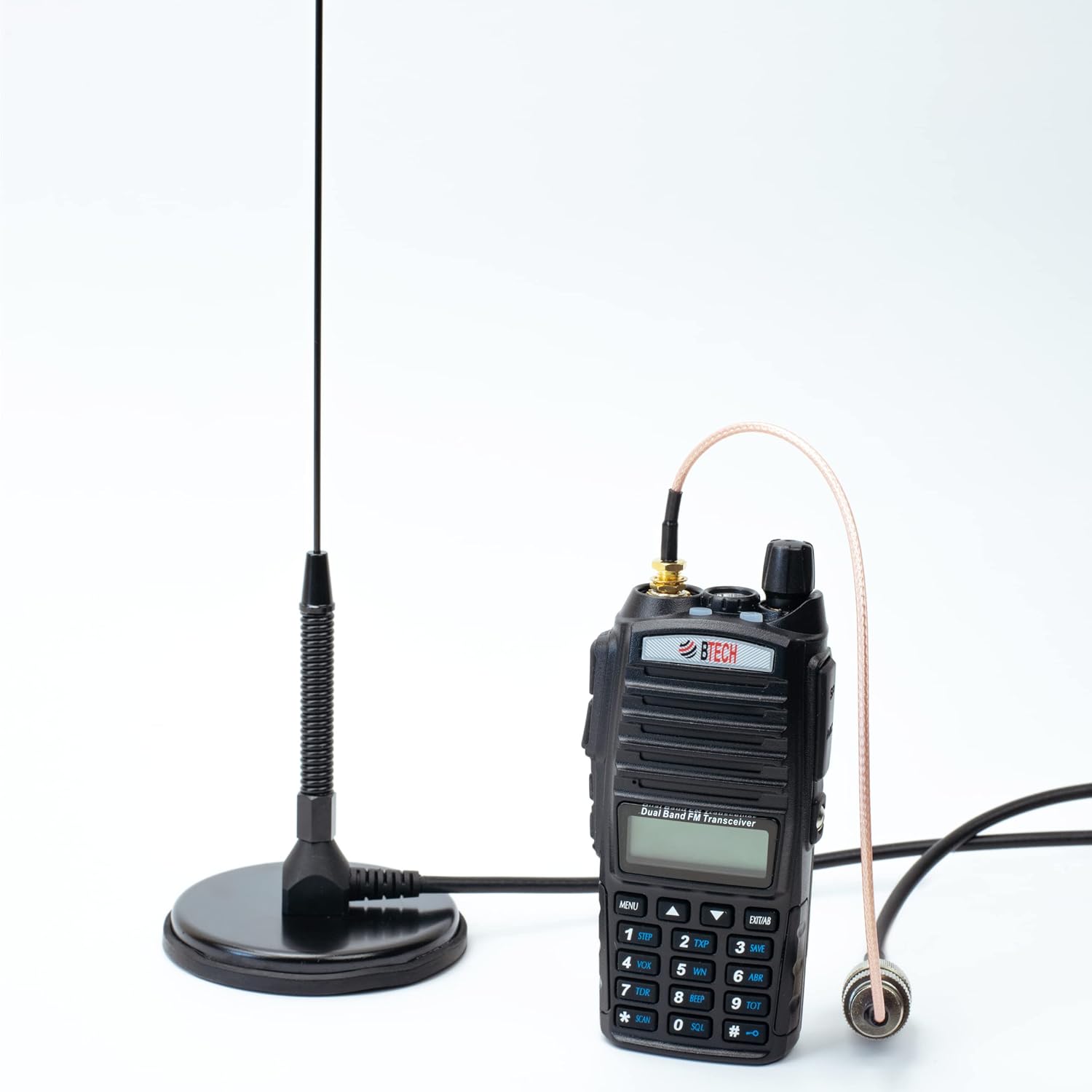 Nagoya UT-72G antenna connected to a handheld GMRS radio via an SMA adapter, demonstrating mobile use.