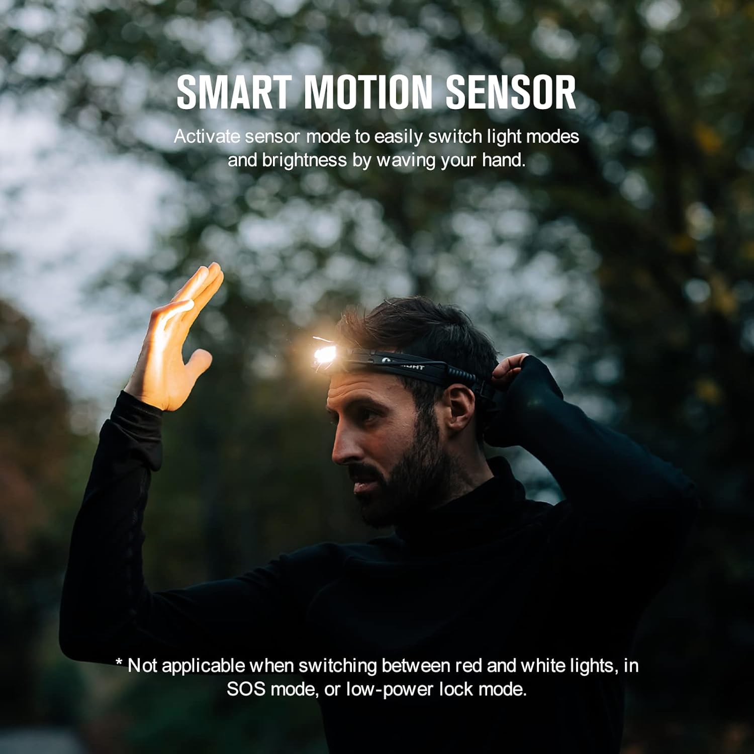 Man activating the motion sensor on the OLIGHT Array 2 Pro headlamp by waving his hand in front of it.