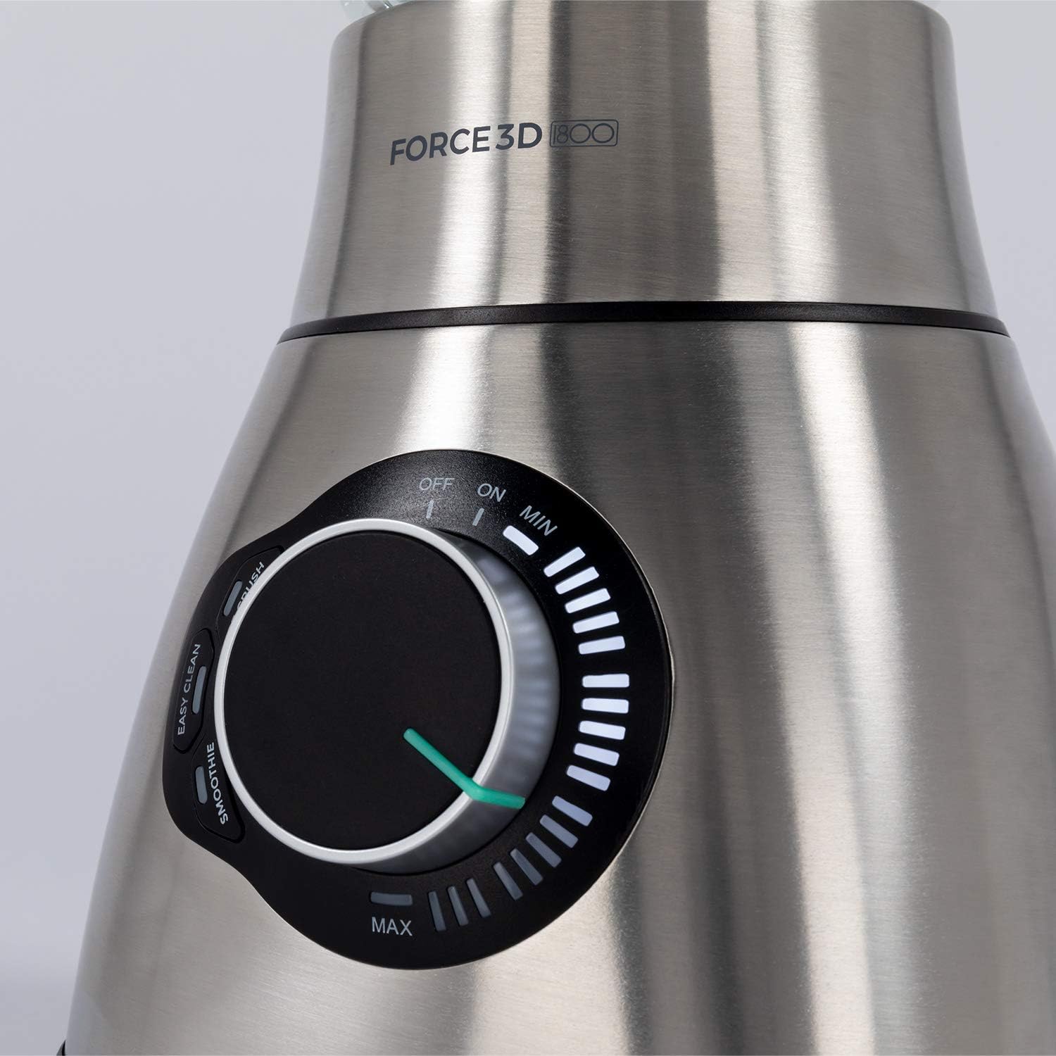 Blender pitcher filled with fresh fruits and vegetables ready for blending.