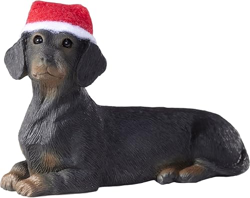 Sandicast Perro salchicha negro con adorno navideño de sombrero de Papá Noel