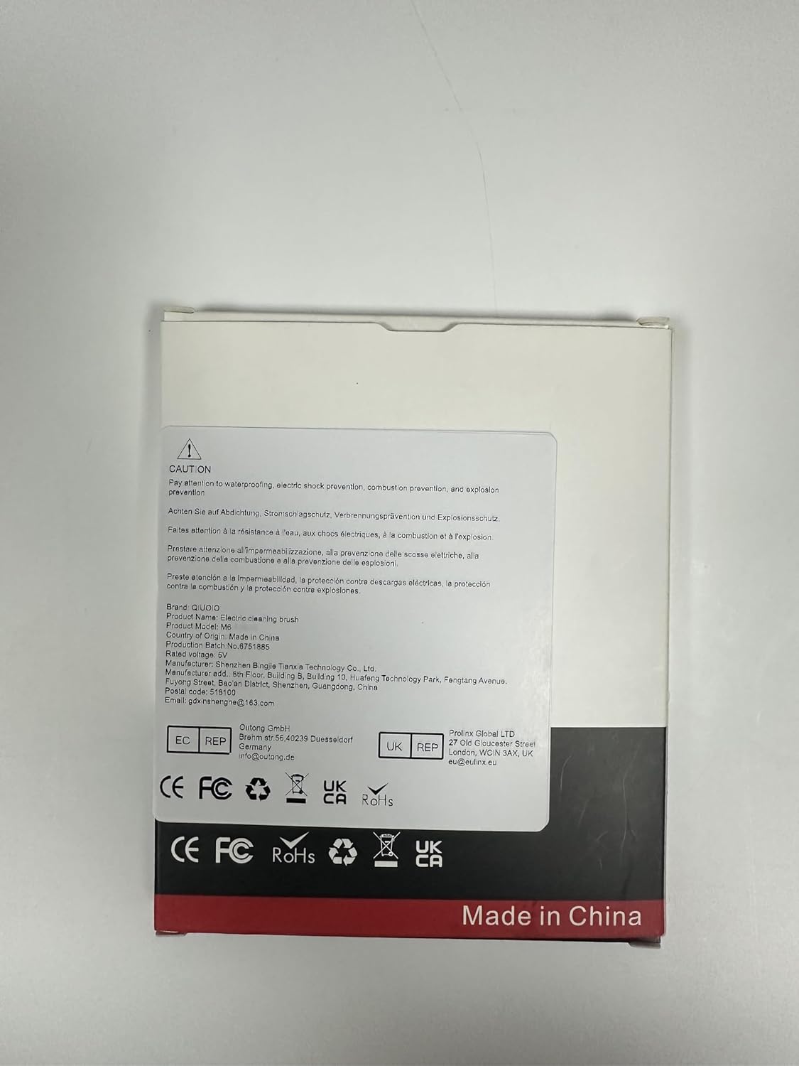 Back of product packaging with caution and manufacturer information