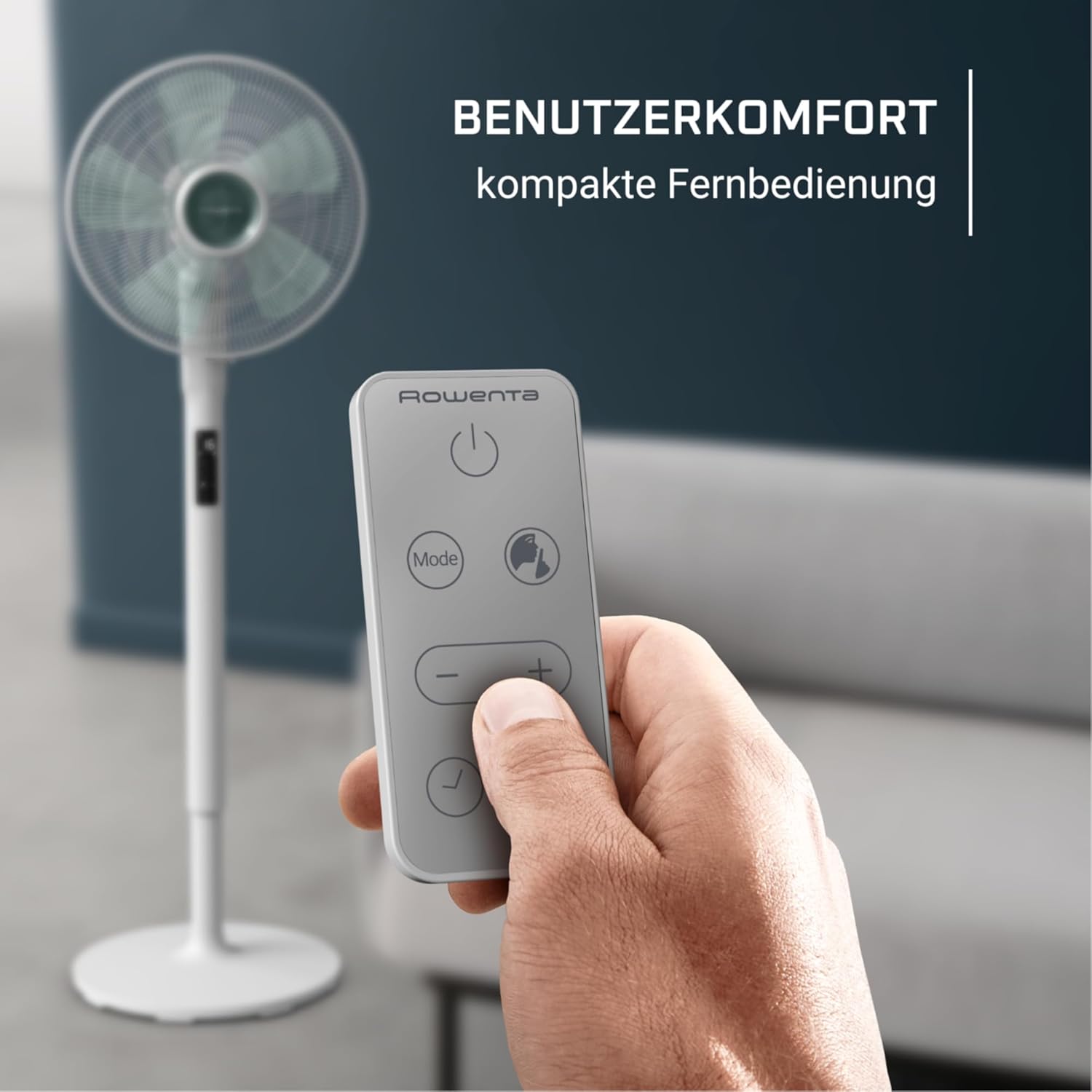 Hand holding the compact remote control for the fan