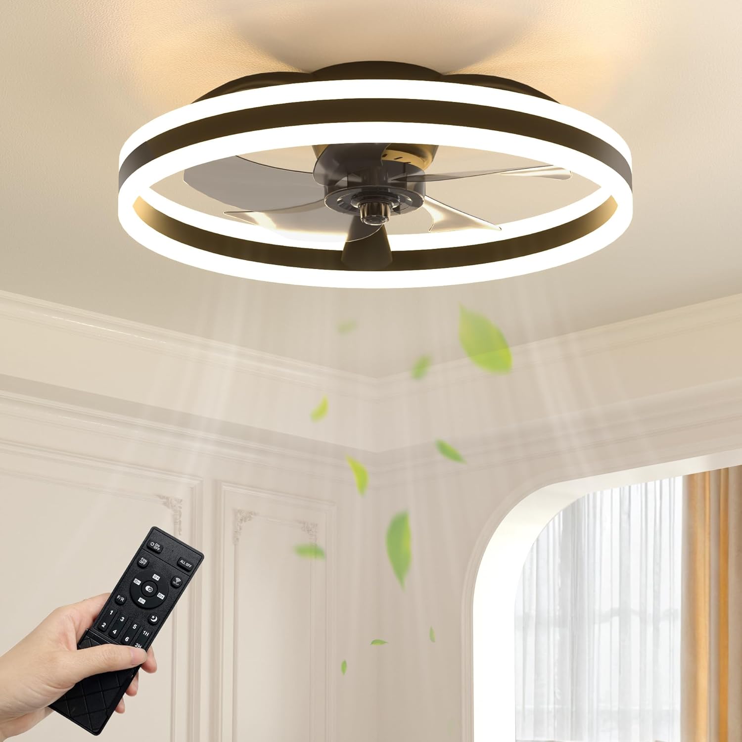 NIORSUN LED 50cm Ceiling Fan with Light installed in a room, with a hand holding the remote control.