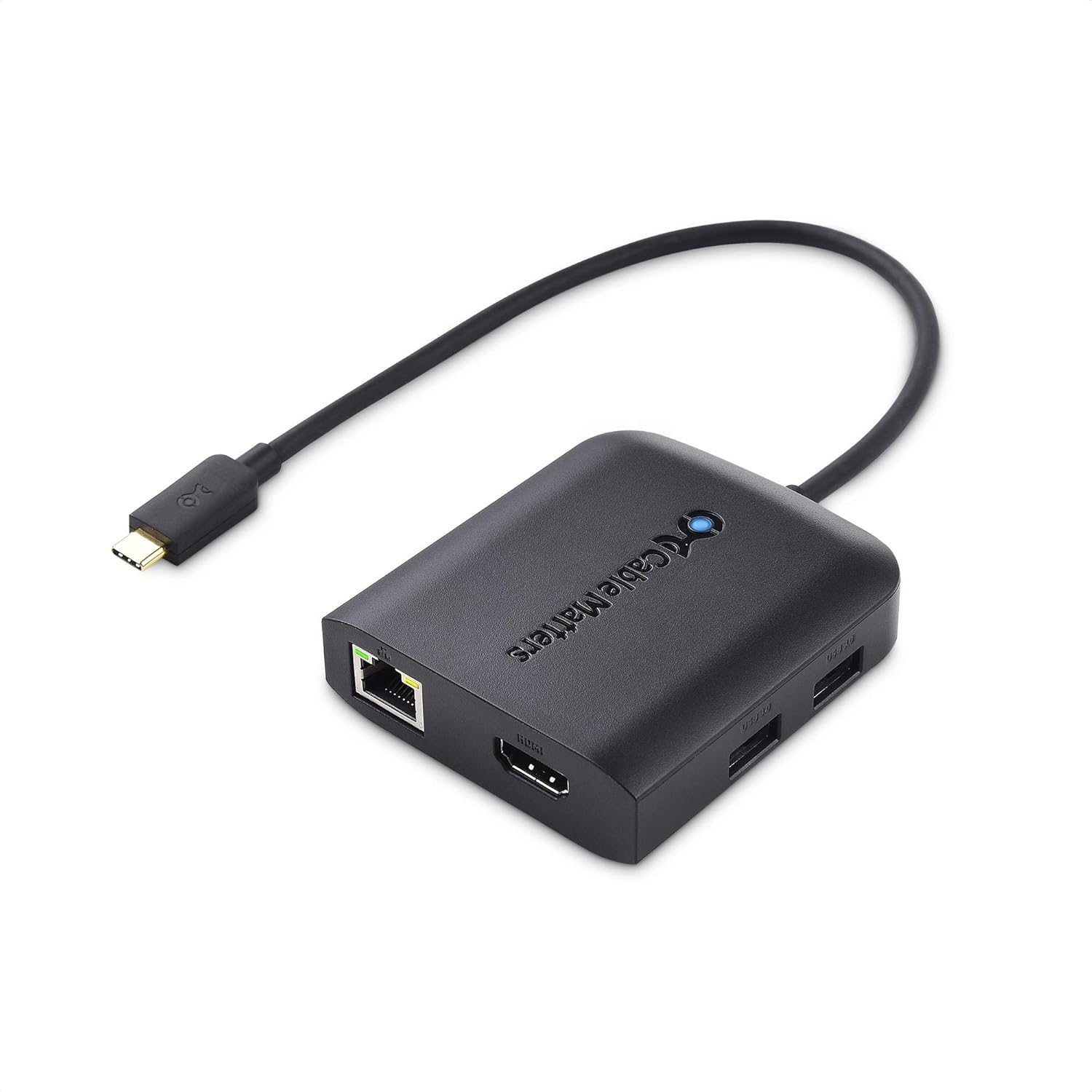 A Cable Matters USB C Hub with an Ethernet cable plugged into its Gigabit Ethernet port.