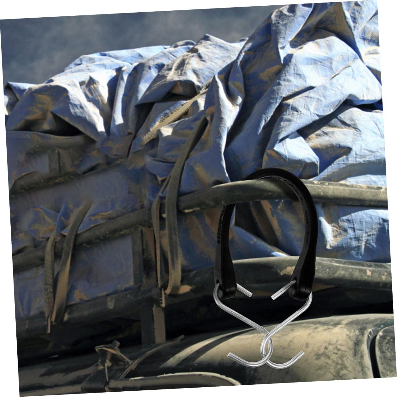 Bungee strap securing a blue tarp on a truck