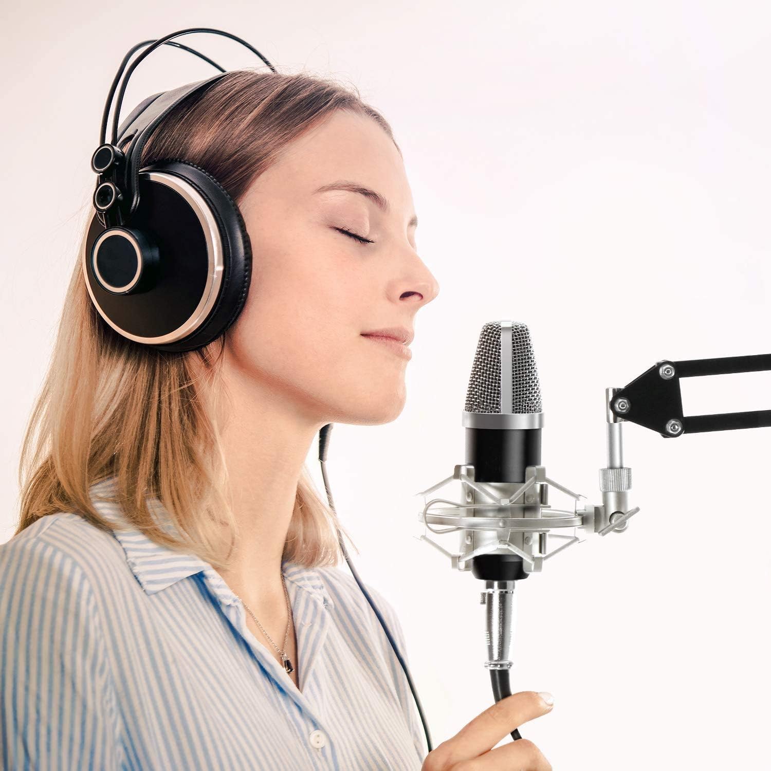 Person singing into the TONOR XLR Condenser Microphone Kit
