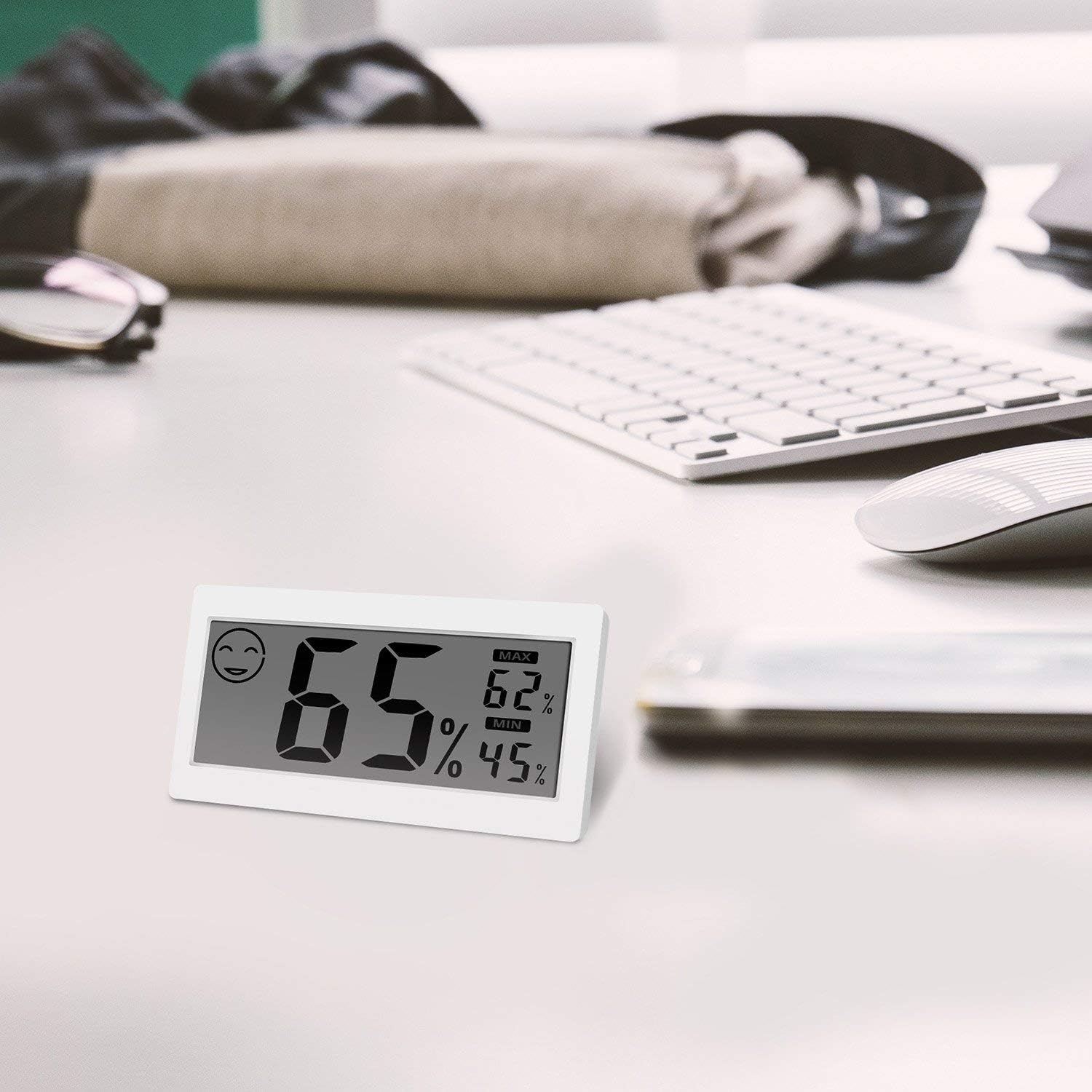 JLENOVEG Digital Thermometer attached to a stainless steel refrigerator door using its magnetic backing.