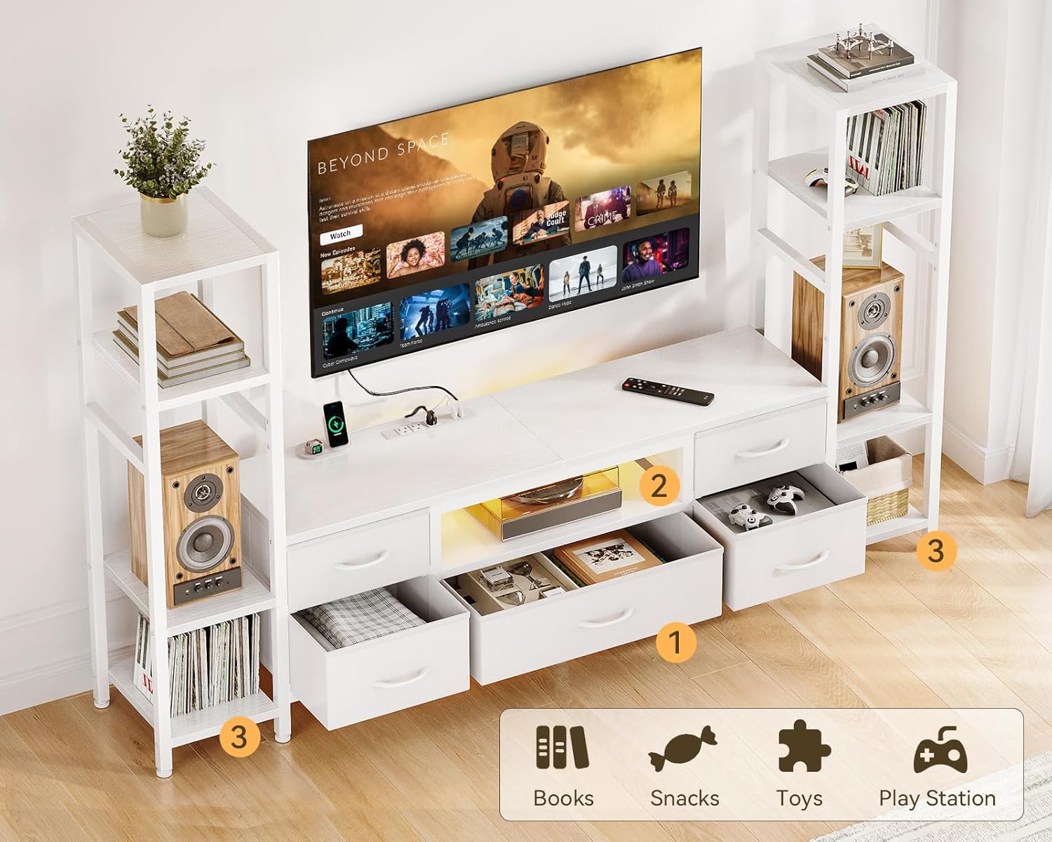 An overhead view of the Casaottima TV Stand showing the five fabric drawers pulled out, revealing storage space for books, snacks, toys, and PlayStation accessories. The side shelves are also visible with items.