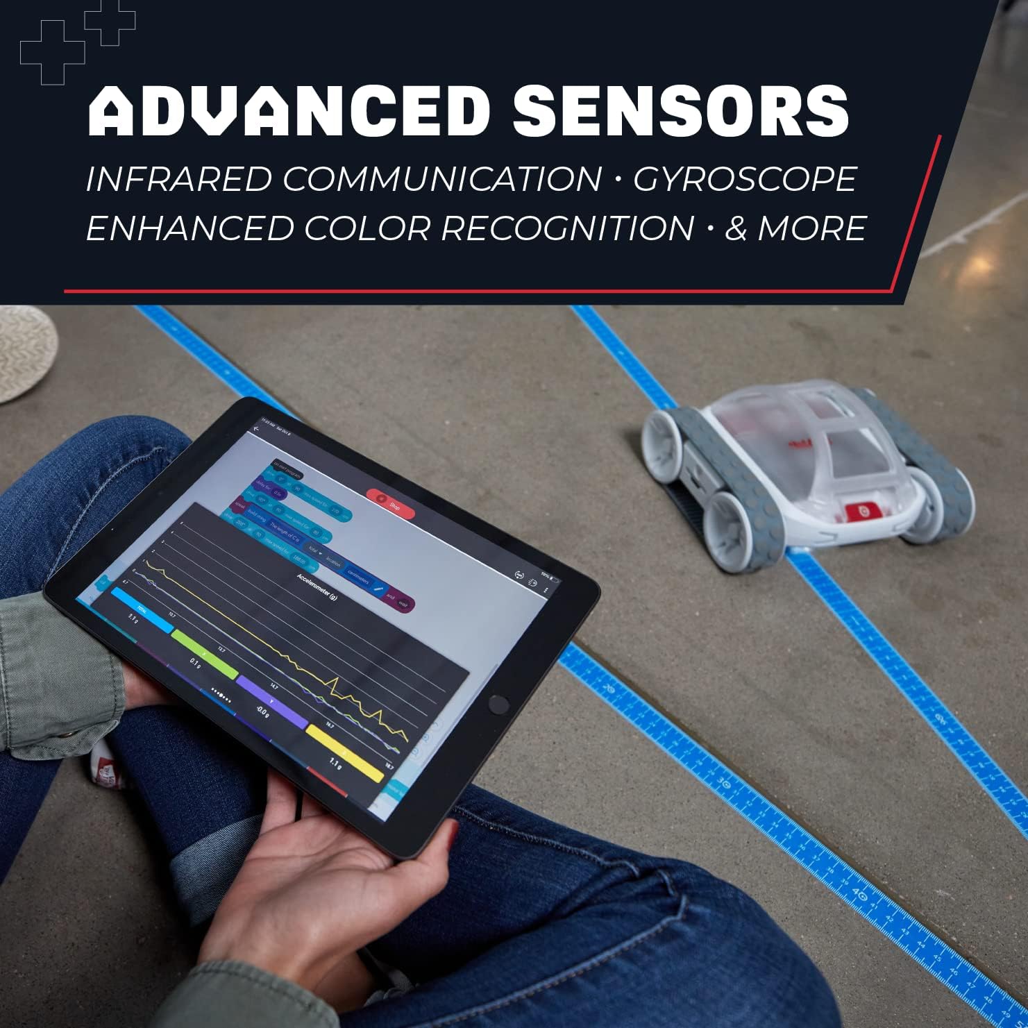 A Sphero RVR+ robot on a marked surface, with a tablet displaying sensor data graphs, illustrating its advanced sensor capabilities.