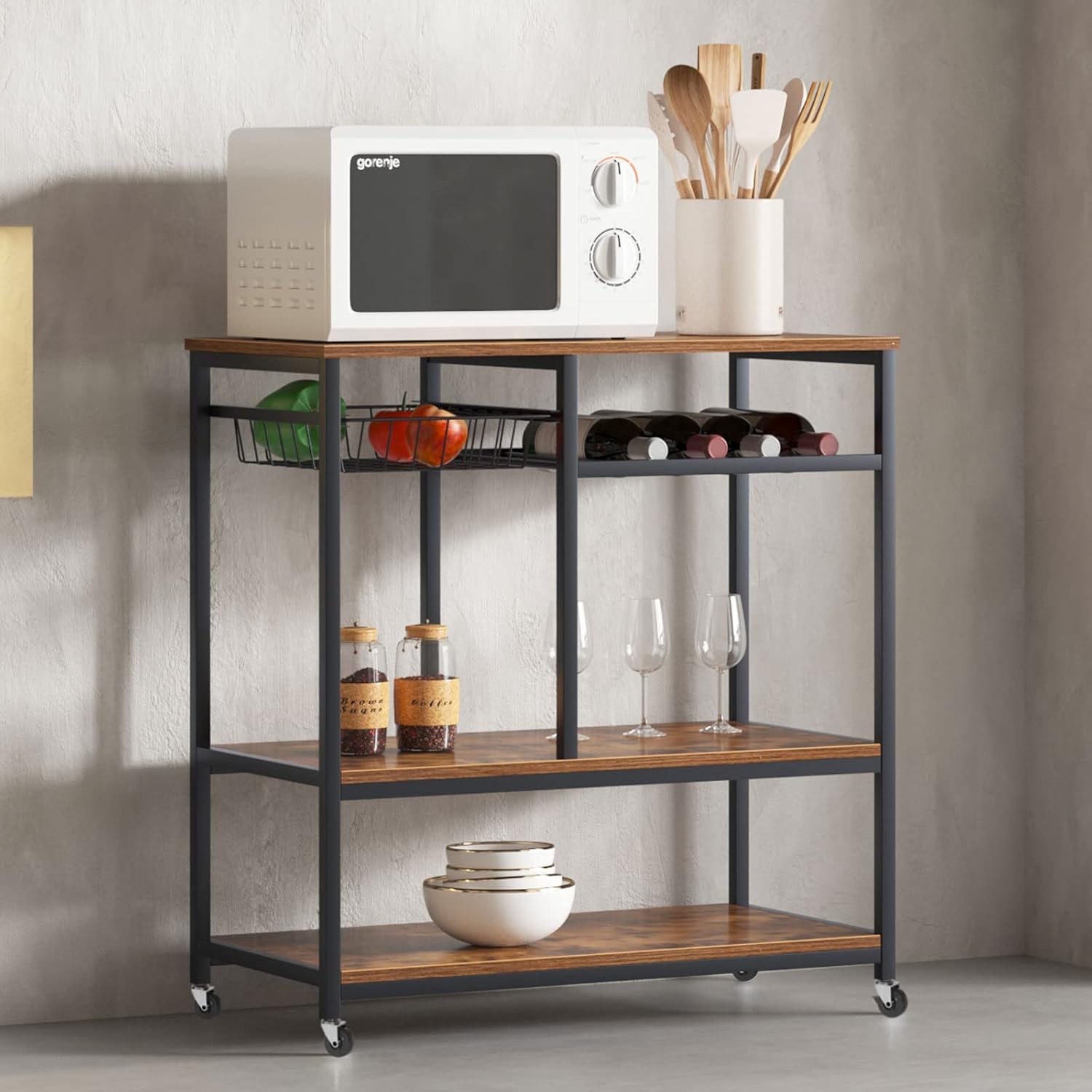 SogesHome Baker's Rack in a kitchen setting, holding a microwave, wine bottles, and other kitchen items.