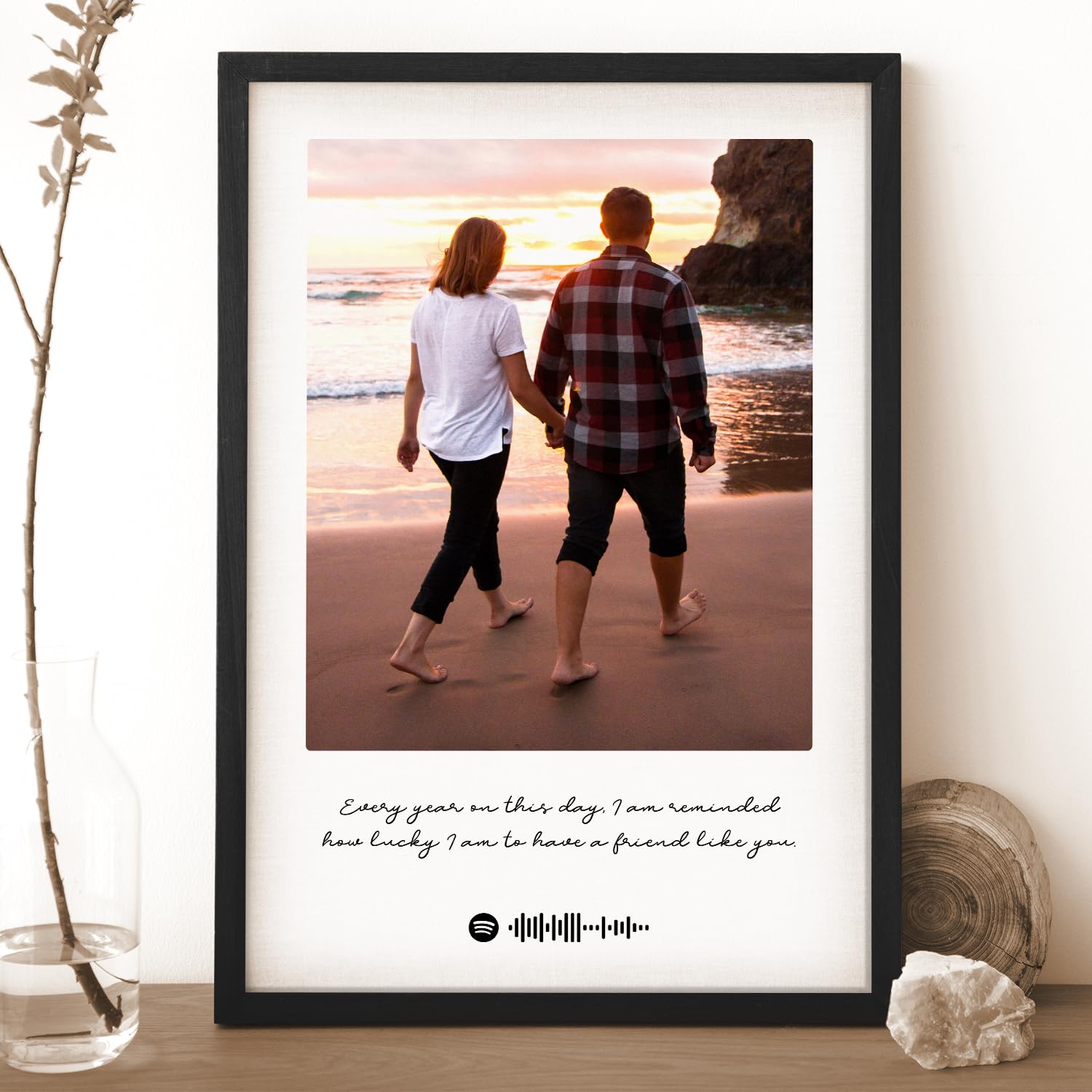 Model wearing women's burgundy red crewneck artwork tee with small white triangle overlapping larger black triangle.