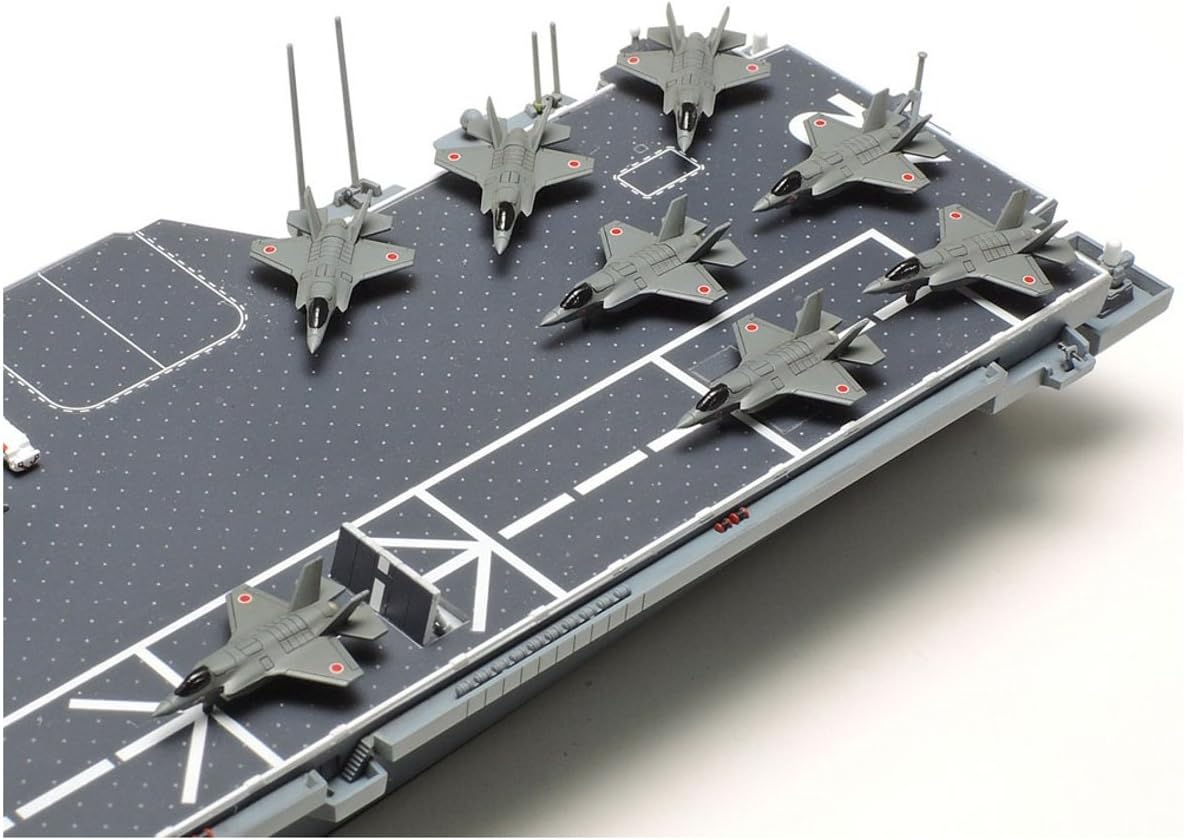 Top-down view of multiple aircraft, including jets and helicopters, arranged on the flight deck of the Tamiya 1/700 Aircraft Carrier DDV192 Ibuki model.